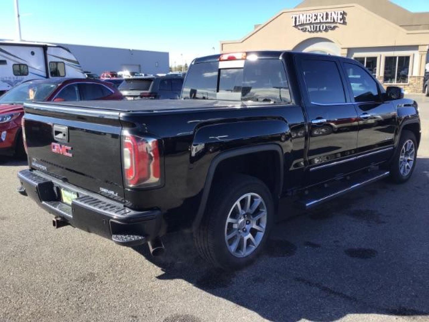 2018 Onyx Black /Cocoa/Dark Sand, leather GMC Sierra 1500 Denali Crew Cab Short Box 4WD (3GTU2PEJ0JG) with an 6.2L V8 OHV 16V engine, 6-Speed Automatic transmission, located at 1235 N Woodruff Ave., Idaho Falls, 83401, (208) 523-1053, 43.507172, -112.000488 - This 2018 GMC 1500 Denali has the 6.2L motor. It has 84,620. This is a really nice truck, that is loaded up with options. At Timberline Auto it is always easy to find a great deal on your next vehicle! Our experienced sales staff can help find the right vehicle that will fit your needs. Our knowledg - Photo#4