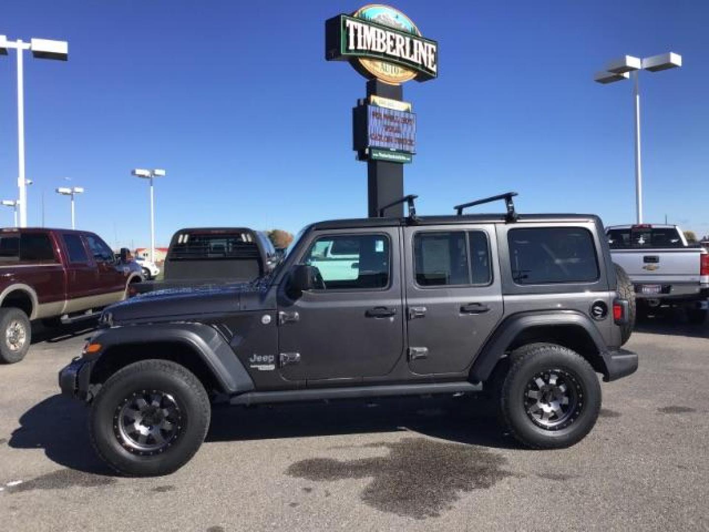 2018 GRAY /CLOTH Jeep Wrangler Unlimited Sport (1C4HJXDG9JW) with an 3.6L V6 DOHC 24V FFV engine, 6-Speed Automatic transmission, located at 1235 N Woodruff Ave., Idaho Falls, 83401, (208) 523-1053, 43.507172, -112.000488 - This 2018 Jeep Wrangler Sport, has the 3.6L V6 motor. It has 120,819 miles. This is a really nice Jeep that has 4x4, keyless remote, bluetooth, power locks and doors. Also comes with Alpine premium sound. At Timberline Auto it is always easy to find a great deal on your next vehicle! Our experienced - Photo#1