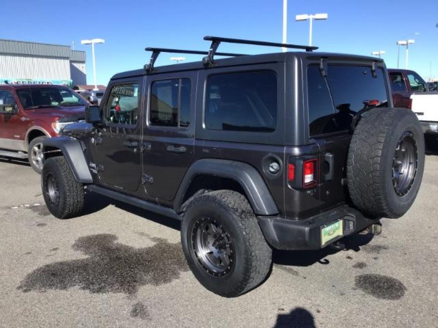 2018 GRAY /CLOTH Jeep Wrangler Unlimited Sport (1C4HJXDG9JW) with an 3.6L V6 DOHC 24V FFV engine, 6-Speed Automatic transmission, located at 1235 N Woodruff Ave., Idaho Falls, 83401, (208) 523-1053, 43.507172, -112.000488 - This 2018 Jeep Wrangler Sport, has the 3.6L V6 motor. It has 120,819 miles. This is a really nice Jeep that has 4x4, keyless remote, bluetooth, power locks and doors. Also comes with Alpine premium sound. At Timberline Auto it is always easy to find a great deal on your next vehicle! Our experienced - Photo#2