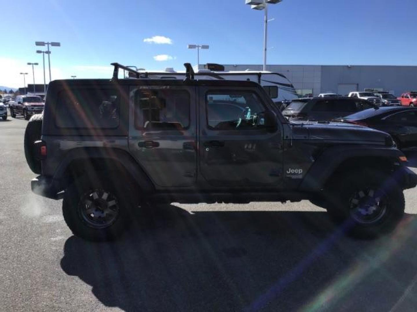 2018 GRAY /CLOTH Jeep Wrangler Unlimited Sport (1C4HJXDG9JW) with an 3.6L V6 DOHC 24V FFV engine, 6-Speed Automatic transmission, located at 1235 N Woodruff Ave., Idaho Falls, 83401, (208) 523-1053, 43.507172, -112.000488 - This 2018 Jeep Wrangler Sport, has the 3.6L V6 motor. It has 120,819 miles. This is a really nice Jeep that has 4x4, keyless remote, bluetooth, power locks and doors. Also comes with Alpine premium sound. At Timberline Auto it is always easy to find a great deal on your next vehicle! Our experienced - Photo#5