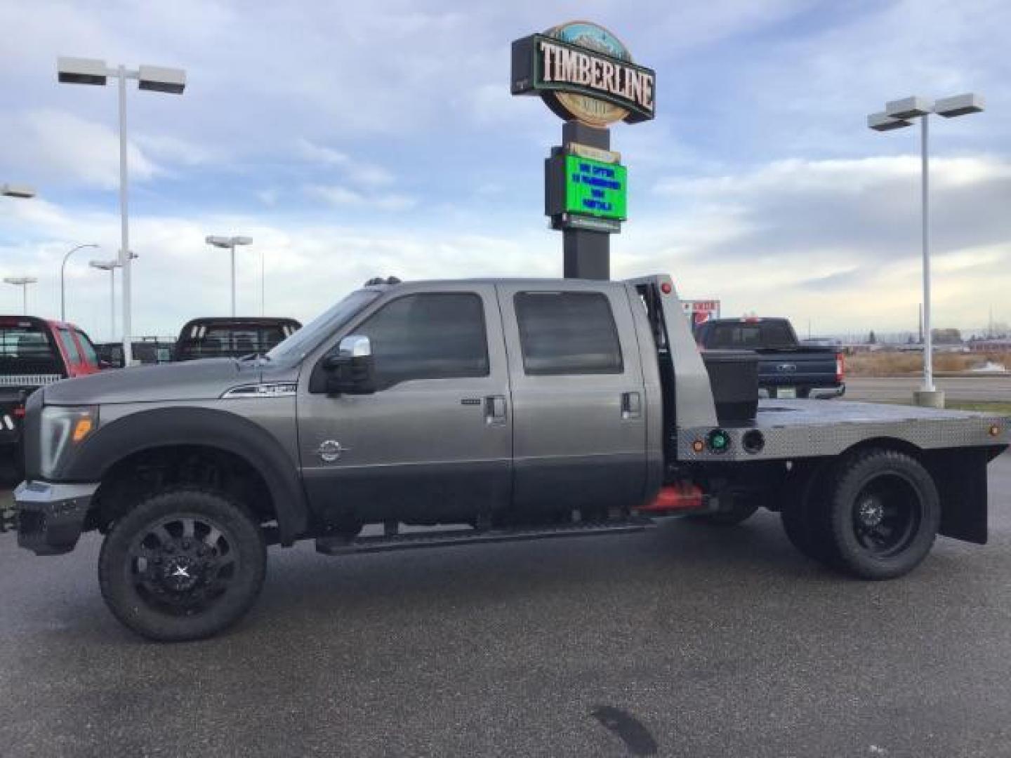 2013 GRAY /Black Leather Interior Ford F-450 SD Lariat Crew Cab DRW 4WD (1FT8W4DT1DE) with an 6.7L V8 OHV 16V DIESEL engine, 6-Speed Automatic transmission, located at 1235 N Woodruff Ave., Idaho Falls, 83401, (208) 523-1053, 43.507172, -112.000488 - This 2013 Ford F450, has the 6.7L diesel motor. It has 223,337 miles. It has a flatbed, with turn over ball. The interior has leather seats, back up camera, heated seats, and power sunroof. At Timberline Auto it is always easy to find a great deal on your next vehicle! Our experienced sales staff ca - Photo#1