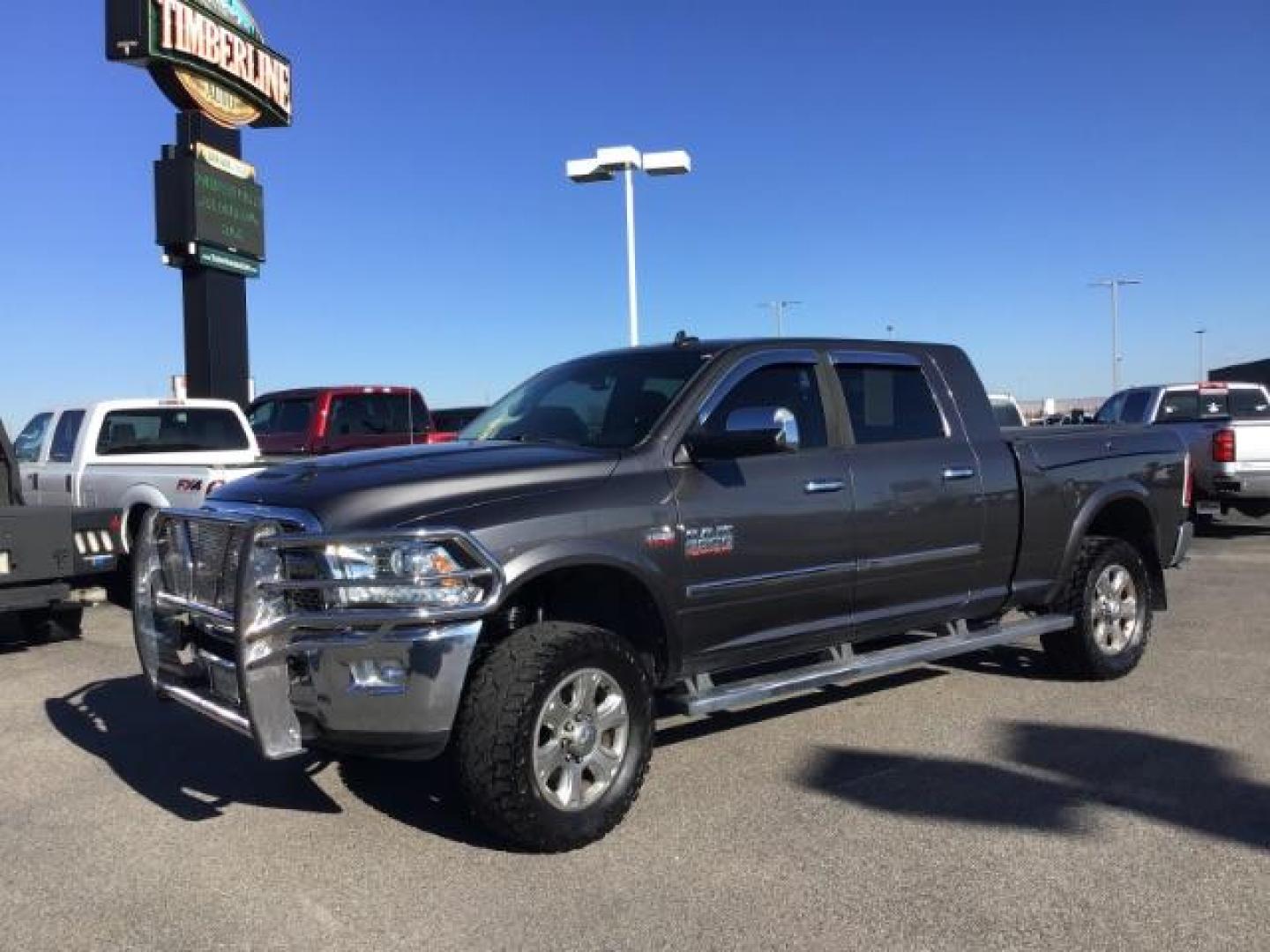 2015 GRAY /LEATHER RAM 2500 Laramie Mega Cab 4WD (3C6UR5NJ9FG) with an 6.4L V8 engine, 6-Speed Automatic transmission, located at 1235 N Woodruff Ave., Idaho Falls, 83401, (208) 523-1053, 43.507172, -112.000488 - This 2015 Ram 2500 Laramie, has the 6.4L V8 Hemi motor. It has 97,556 miles. It has the Mega Cab, and is loaded, with leather seats, keyless remote, power locks, dual power seats, back up camera, heated seats, and a soft tonneau cover. At Timberline Auto it is always easy to find a great deal on yo - Photo#0