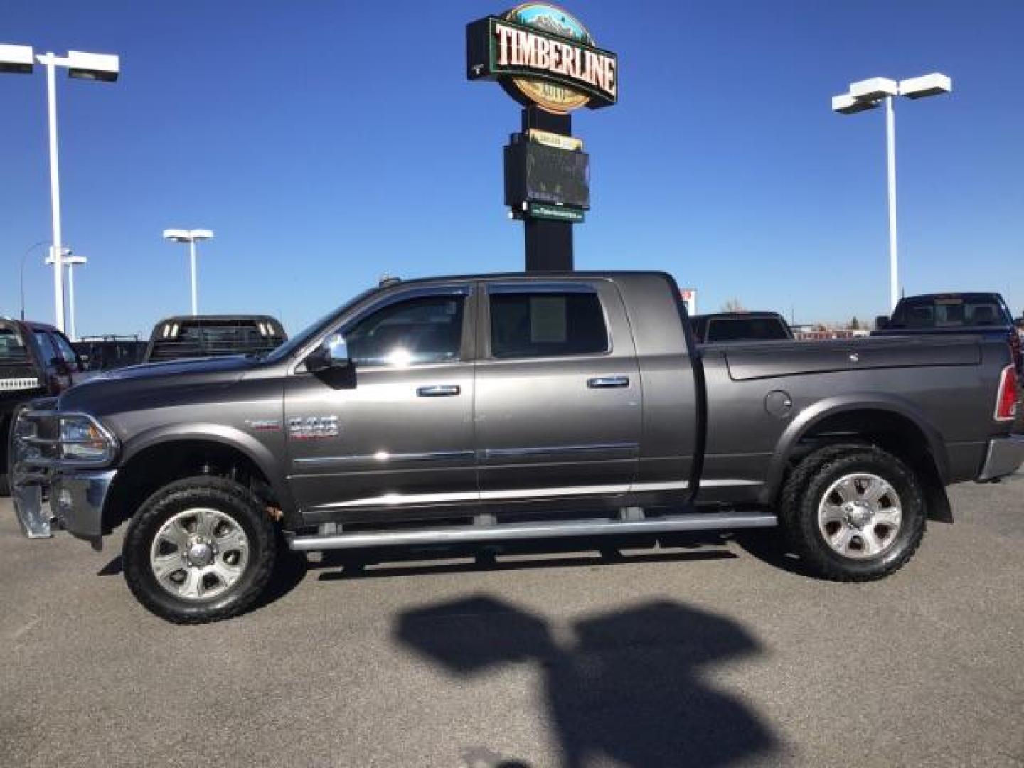 2015 GRAY /LEATHER RAM 2500 Laramie Mega Cab 4WD (3C6UR5NJ9FG) with an 6.4L V8 engine, 6-Speed Automatic transmission, located at 1235 N Woodruff Ave., Idaho Falls, 83401, (208) 523-1053, 43.507172, -112.000488 - This 2015 Ram 2500 Laramie, has the 6.4L V8 Hemi motor. It has 97,556 miles. It has the Mega Cab, and is loaded, with leather seats, keyless remote, power locks, dual power seats, back up camera, heated seats, and a soft tonneau cover. At Timberline Auto it is always easy to find a great deal on yo - Photo#1