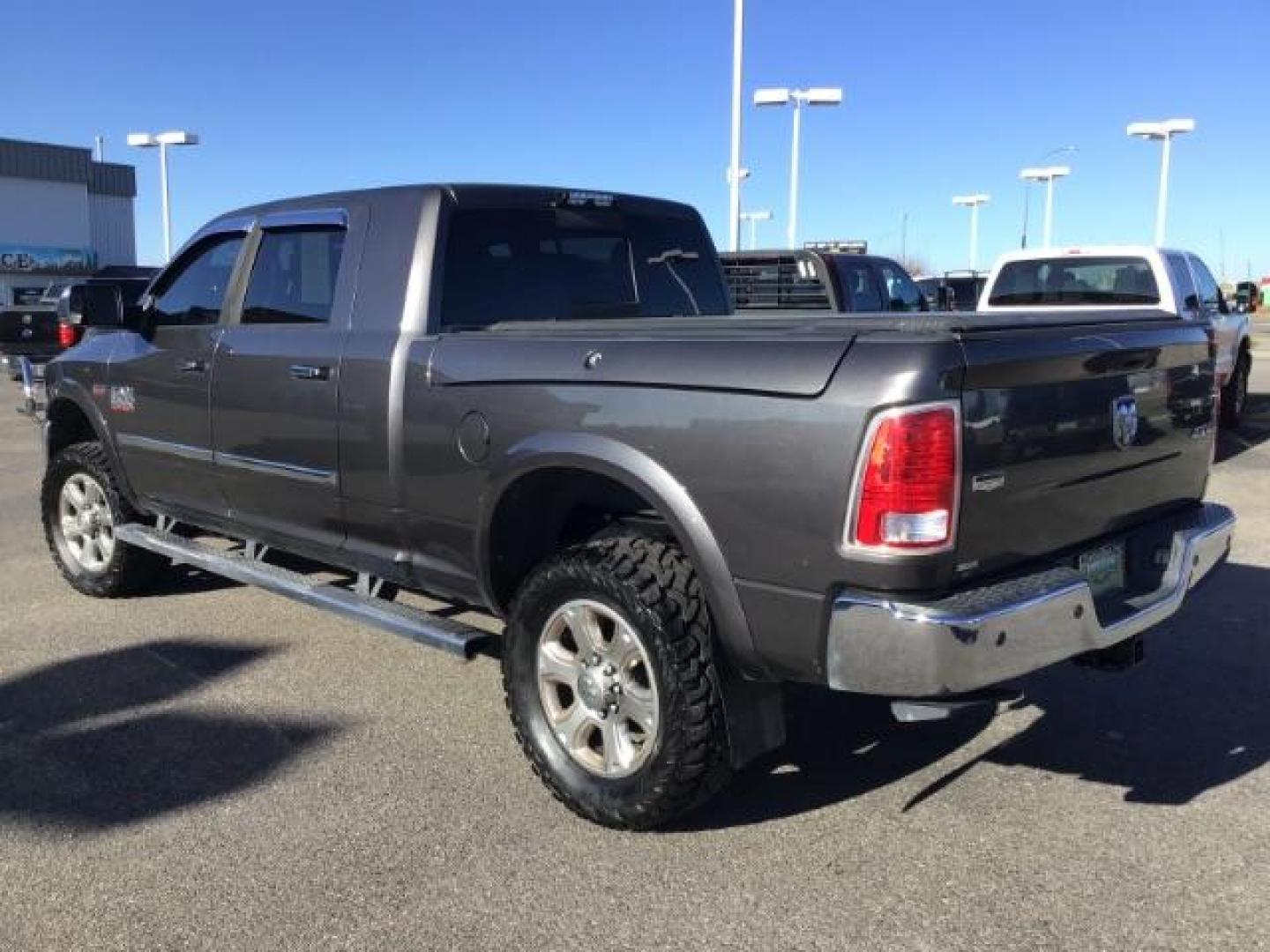 2015 GRAY /LEATHER RAM 2500 Laramie Mega Cab 4WD (3C6UR5NJ9FG) with an 6.4L V8 engine, 6-Speed Automatic transmission, located at 1235 N Woodruff Ave., Idaho Falls, 83401, (208) 523-1053, 43.507172, -112.000488 - This 2015 Ram 2500 Laramie, has the 6.4L V8 Hemi motor. It has 97,556 miles. It has the Mega Cab, and is loaded, with leather seats, keyless remote, power locks, dual power seats, back up camera, heated seats, and a soft tonneau cover. At Timberline Auto it is always easy to find a great deal on yo - Photo#2