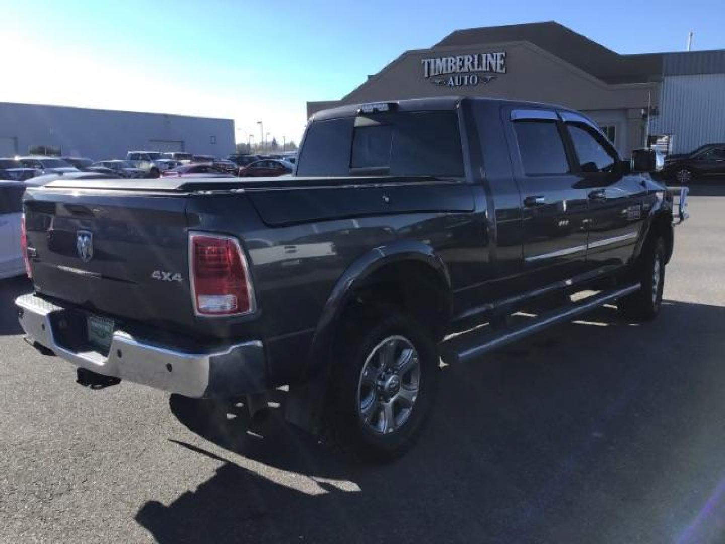 2015 GRAY /LEATHER RAM 2500 Laramie Mega Cab 4WD (3C6UR5NJ9FG) with an 6.4L V8 engine, 6-Speed Automatic transmission, located at 1235 N Woodruff Ave., Idaho Falls, 83401, (208) 523-1053, 43.507172, -112.000488 - This 2015 Ram 2500 Laramie, has the 6.4L V8 Hemi motor. It has 97,556 miles. It has the Mega Cab, and is loaded, with leather seats, keyless remote, power locks, dual power seats, back up camera, heated seats, and a soft tonneau cover. At Timberline Auto it is always easy to find a great deal on yo - Photo#4