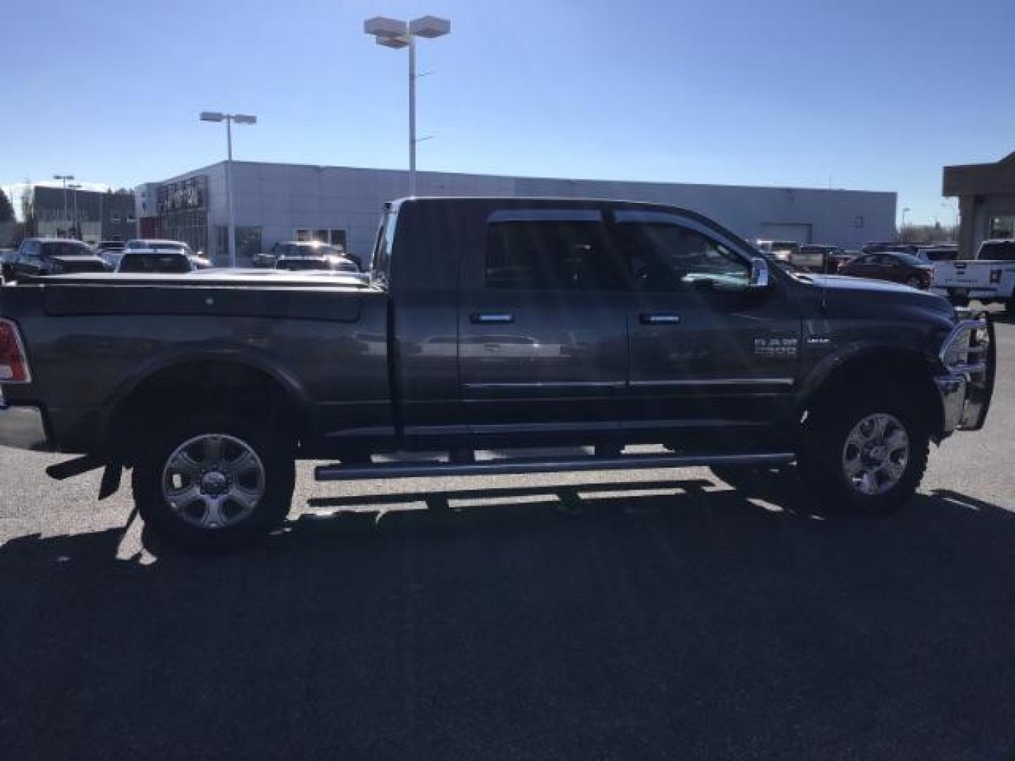 2015 GRAY /LEATHER RAM 2500 Laramie Mega Cab 4WD (3C6UR5NJ9FG) with an 6.4L V8 engine, 6-Speed Automatic transmission, located at 1235 N Woodruff Ave., Idaho Falls, 83401, (208) 523-1053, 43.507172, -112.000488 - This 2015 Ram 2500 Laramie, has the 6.4L V8 Hemi motor. It has 97,556 miles. It has the Mega Cab, and is loaded, with leather seats, keyless remote, power locks, dual power seats, back up camera, heated seats, and a soft tonneau cover. At Timberline Auto it is always easy to find a great deal on yo - Photo#5