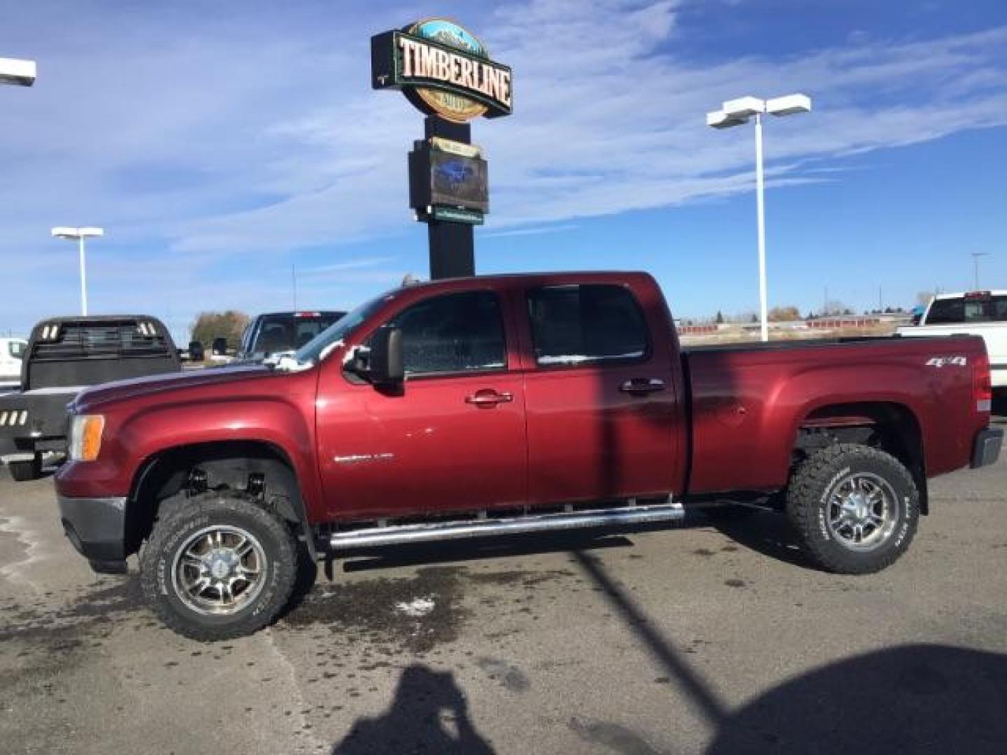 2013 Sonoma Red Metallic /Dark Titanium/Light Titanium Leather Interior GMC Sierra 2500HD SLT Crew Cab 4WD (1GT121C81DF) with an 6.6L V8 OHV 32V TURBO DIESEL engine, 6-Speed Automatic transmission, located at 1235 N Woodruff Ave., Idaho Falls, 83401, (208) 523-1053, 43.507172, -112.000488 - This 2013 GMC Sierra SLT 4x4, has the 6.6L duramax motor. It has 124,000 miles. Comes with leather interior, heated seats, blue tooth, dual power seats, key less remote, and turn over ball. At Timberline Auto it is always easy to find a great deal on your next vehicle! Our experienced sales staff ca - Photo#1