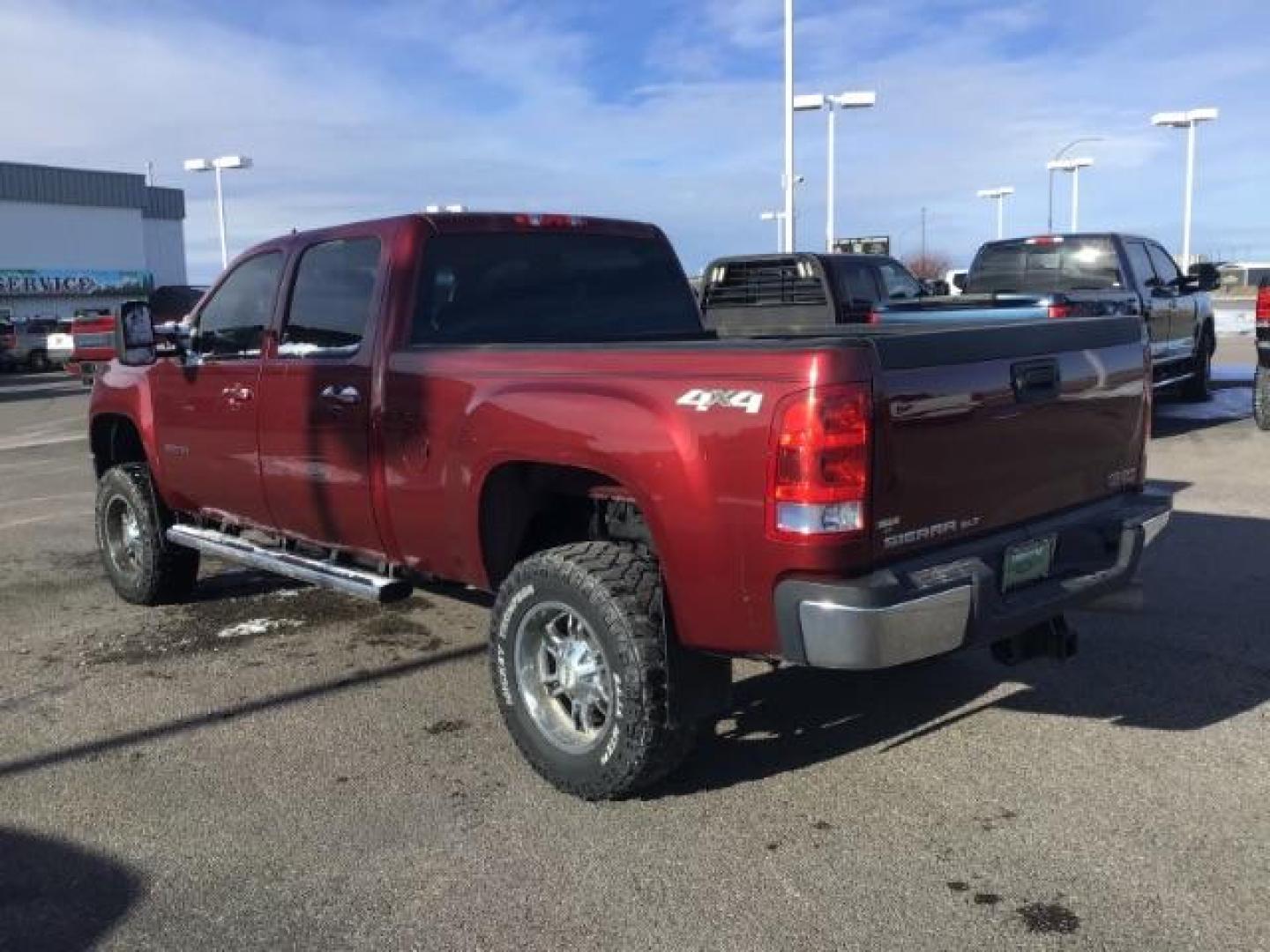 2013 Sonoma Red Metallic /Dark Titanium/Light Titanium Leather Interior GMC Sierra 2500HD SLT Crew Cab 4WD (1GT121C81DF) with an 6.6L V8 OHV 32V TURBO DIESEL engine, 6-Speed Automatic transmission, located at 1235 N Woodruff Ave., Idaho Falls, 83401, (208) 523-1053, 43.507172, -112.000488 - This 2013 GMC Sierra SLT 4x4, has the 6.6L duramax motor. It has 124,000 miles. Comes with leather interior, heated seats, blue tooth, dual power seats, key less remote, and turn over ball. At Timberline Auto it is always easy to find a great deal on your next vehicle! Our experienced sales staff ca - Photo#2