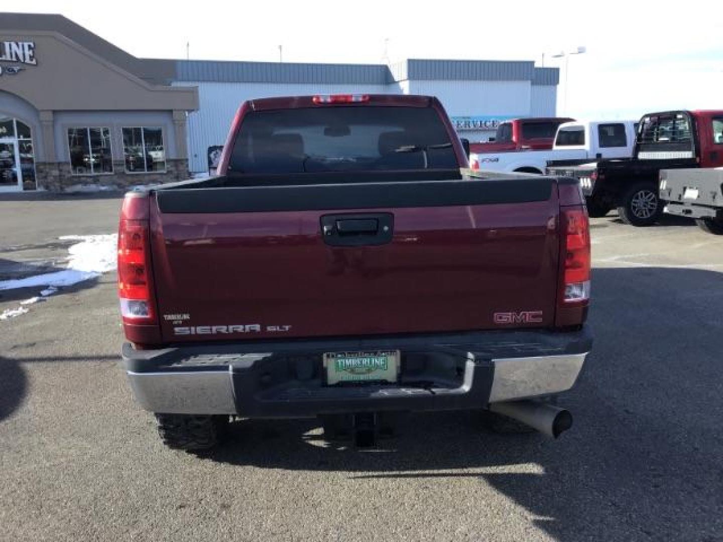 2013 Sonoma Red Metallic /Dark Titanium/Light Titanium Leather Interior GMC Sierra 2500HD SLT Crew Cab 4WD (1GT121C81DF) with an 6.6L V8 OHV 32V TURBO DIESEL engine, 6-Speed Automatic transmission, located at 1235 N Woodruff Ave., Idaho Falls, 83401, (208) 523-1053, 43.507172, -112.000488 - This 2013 GMC Sierra SLT 4x4, has the 6.6L duramax motor. It has 124,000 miles. Comes with leather interior, heated seats, blue tooth, dual power seats, key less remote, and turn over ball. At Timberline Auto it is always easy to find a great deal on your next vehicle! Our experienced sales staff ca - Photo#3