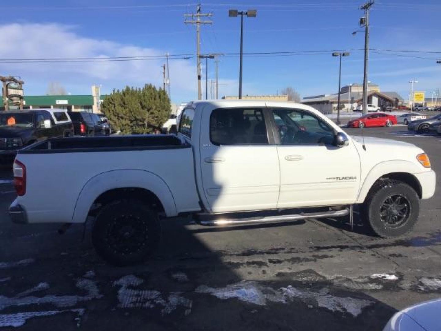 2004 Natural White /Gray Cloth Interior Toyota Tundra SR5 Double Cab 4WD (5TBDT44144S) with an 4.7L V8 DOHC 32V engine, 4-Speed Automatic transmission, located at 1235 N Woodruff Ave., Idaho Falls, 83401, (208) 523-1053, 43.507172, -112.000488 - This 2004 Toyota Tundra SR5 Double Cab 4WD, has cloth interior, cruise control, and AM/FM CD stereo. At Timberline Auto it is always easy to find a great deal on your next vehicle! Our experienced sales staff can help find the right vehicle will fit your needs. Our knowledgeable finance department h - Photo#5