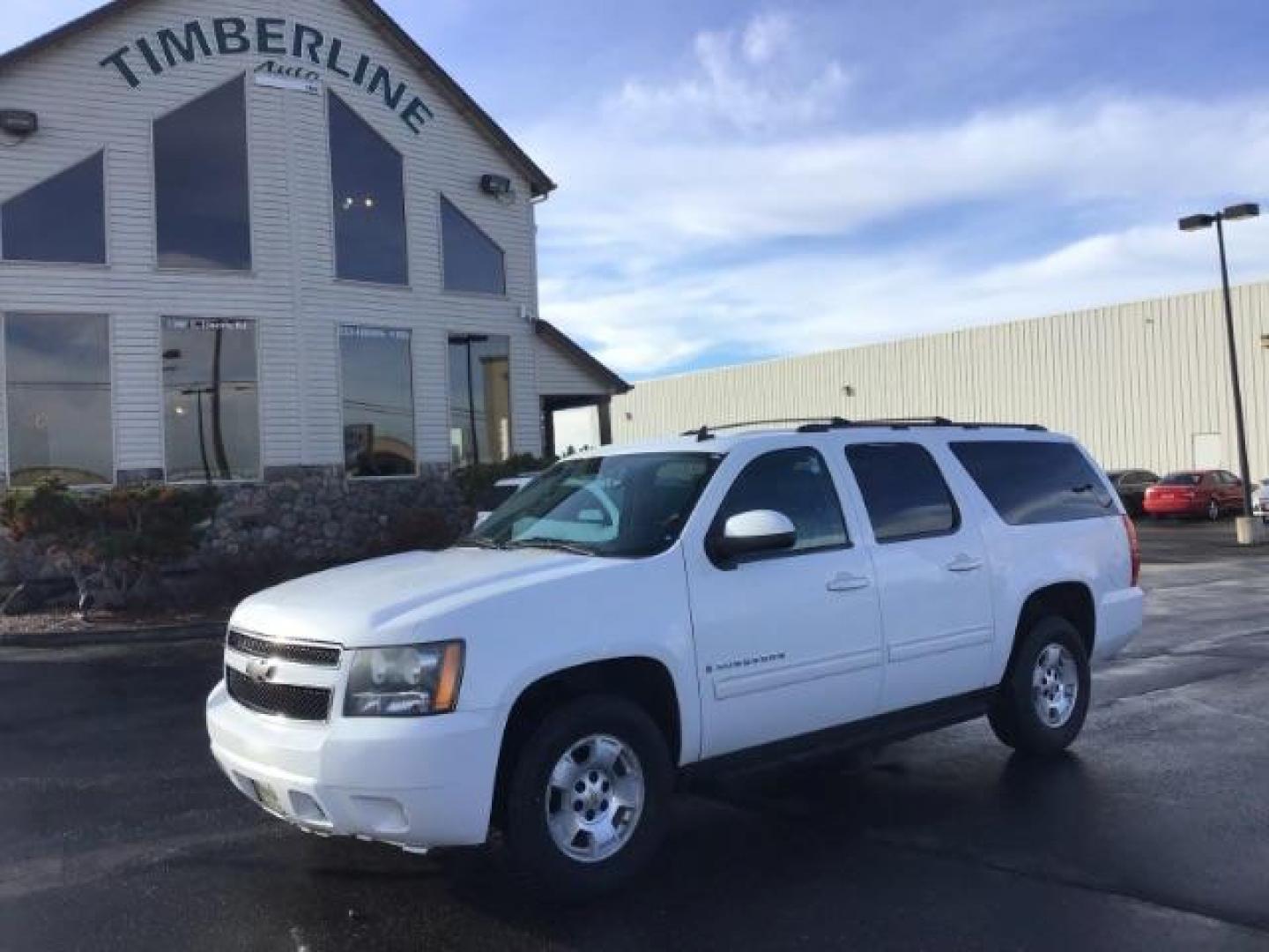 2009 Summit White /Light Titanium/Dark Titanium Cloth Interior Chevrolet Suburban LT1 1500 4WD (1GNFK26399R) with an 5.3L V8 OHV 16V FFV engine, 6-Speed Automatic transmission, located at 1235 N Woodruff Ave., Idaho Falls, 83401, (208) 523-1053, 43.507172, -112.000488 - This 2009 Chevrolet Suburban LT, has the 5.3L V8. It has leather interior, powered seats, cruise control, and 3rd row seating. At Timberline Auto it is always easy to find a great deal on your next vehicle! Our experienced sales staff can help find the right vehicle will fit your needs. Our knowledg - Photo#0