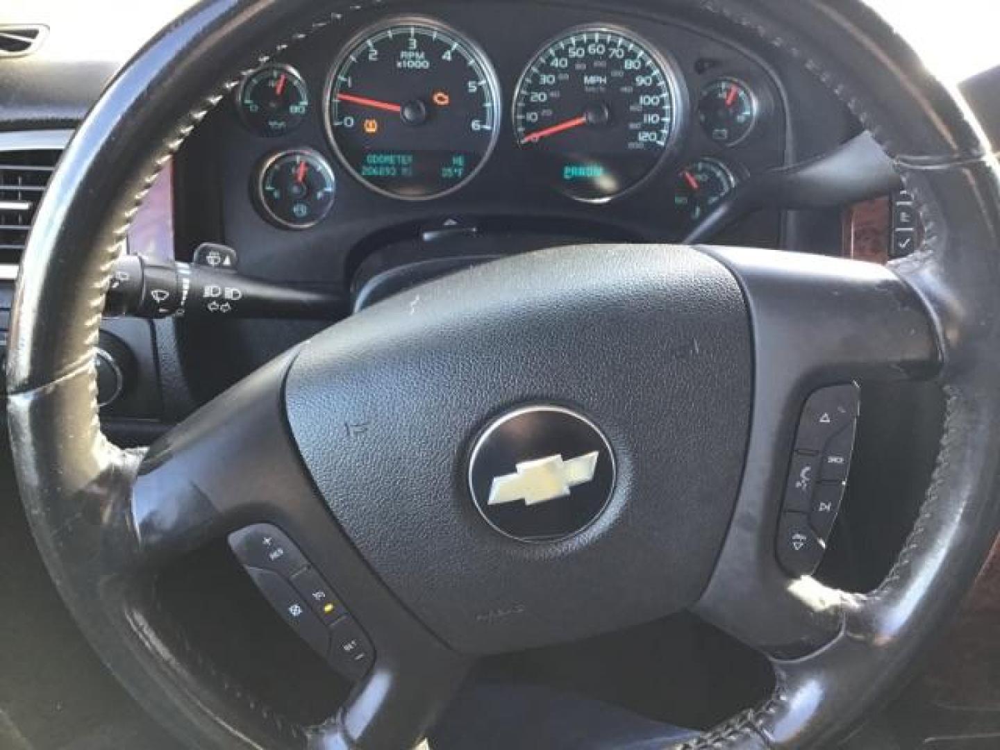 2009 Summit White /Light Titanium/Dark Titanium Cloth Interior Chevrolet Suburban LT1 1500 4WD (1GNFK26399R) with an 5.3L V8 OHV 16V FFV engine, 6-Speed Automatic transmission, located at 1235 N Woodruff Ave., Idaho Falls, 83401, (208) 523-1053, 43.507172, -112.000488 - This 2009 Chevrolet Suburban LT, has the 5.3L V8. It has leather interior, powered seats, cruise control, and 3rd row seating. At Timberline Auto it is always easy to find a great deal on your next vehicle! Our experienced sales staff can help find the right vehicle will fit your needs. Our knowledg - Photo#13