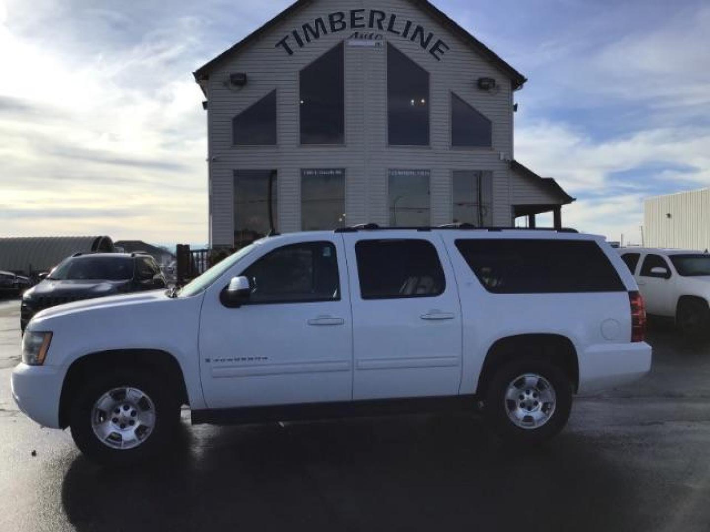 2009 Summit White /Light Titanium/Dark Titanium Cloth Interior Chevrolet Suburban LT1 1500 4WD (1GNFK26399R) with an 5.3L V8 OHV 16V FFV engine, 6-Speed Automatic transmission, located at 1235 N Woodruff Ave., Idaho Falls, 83401, (208) 523-1053, 43.507172, -112.000488 - This 2009 Chevrolet Suburban LT, has the 5.3L V8. It has leather interior, powered seats, cruise control, and 3rd row seating. At Timberline Auto it is always easy to find a great deal on your next vehicle! Our experienced sales staff can help find the right vehicle will fit your needs. Our knowledg - Photo#1