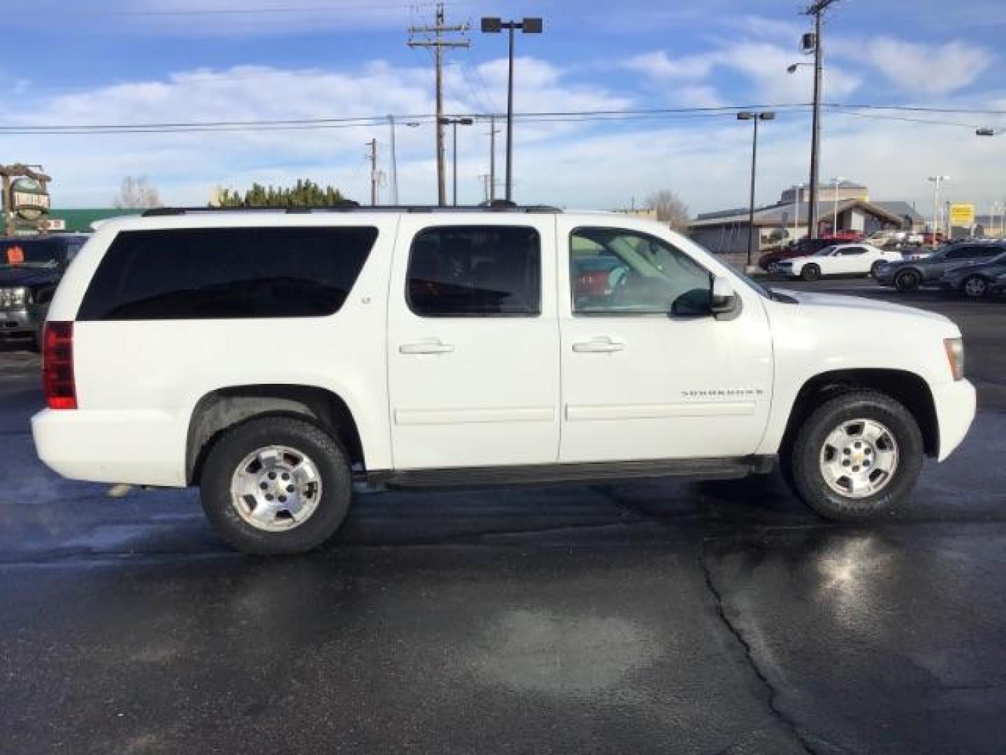 2009 Summit White /Light Titanium/Dark Titanium Cloth Interior Chevrolet Suburban LT1 1500 4WD (1GNFK26399R) with an 5.3L V8 OHV 16V FFV engine, 6-Speed Automatic transmission, located at 1235 N Woodruff Ave., Idaho Falls, 83401, (208) 523-1053, 43.507172, -112.000488 - This 2009 Chevrolet Suburban LT, has the 5.3L V8. It has leather interior, powered seats, cruise control, and 3rd row seating. At Timberline Auto it is always easy to find a great deal on your next vehicle! Our experienced sales staff can help find the right vehicle will fit your needs. Our knowledg - Photo#5