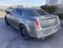 2012 Tungsten Metallic Chrysler 300 Limited RWD (2C3CCACG9CH) with an 3.6L V6 SOHC 24V engine, located at 1235 N Woodruff Ave., Idaho Falls, 83401, (208) 523-1053, 43.507172, -112.000488 - Photo#2