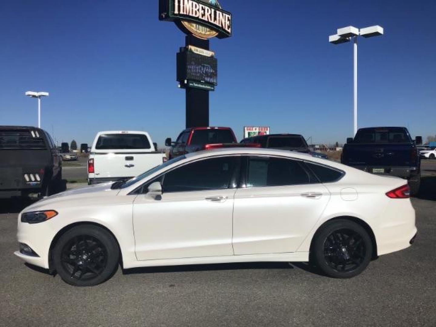 2017 Oxford White Clearcoat /Medium Light Stone, leather Ford Fusion SE (3FA6P0H93HR) with an 2.0L L4 DOHC 16V engine, 6-Speed Automatic transmission, located at 1235 N Woodruff Ave., Idaho Falls, 83401, (208) 523-1053, 43.507172, -112.000488 - This 2017 Ford Fusion SE, has the 4cyl. motor. It comes with leather seats, push button start, heated seats, power locks, power windows, and power seats. At Timberline Auto it is always easy to find a great deal on your next vehicle! Our experienced sales staff can help find the right vehicle that w - Photo#1