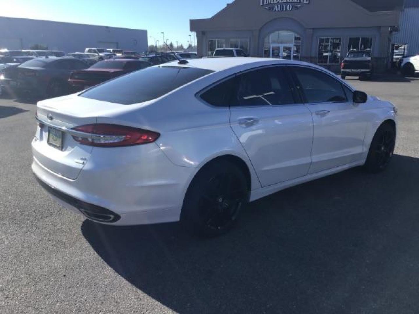 2017 Oxford White Clearcoat /Medium Light Stone, leather Ford Fusion SE (3FA6P0H93HR) with an 2.0L L4 DOHC 16V engine, 6-Speed Automatic transmission, located at 1235 N Woodruff Ave., Idaho Falls, 83401, (208) 523-1053, 43.507172, -112.000488 - This 2017 Ford Fusion SE, has the 4cyl. motor. It comes with leather seats, push button start, heated seats, power locks, power windows, and power seats. At Timberline Auto it is always easy to find a great deal on your next vehicle! Our experienced sales staff can help find the right vehicle that w - Photo#4