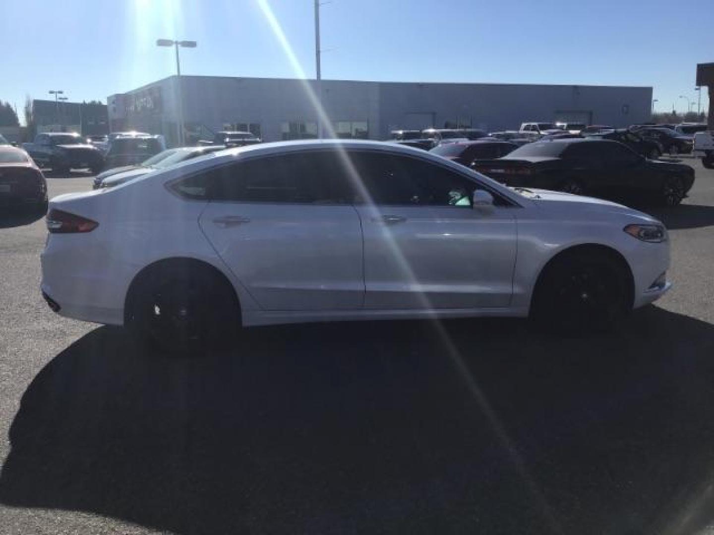 2017 Oxford White Clearcoat /Medium Light Stone, leather Ford Fusion SE (3FA6P0H93HR) with an 2.0L L4 DOHC 16V engine, 6-Speed Automatic transmission, located at 1235 N Woodruff Ave., Idaho Falls, 83401, (208) 523-1053, 43.507172, -112.000488 - This 2017 Ford Fusion SE, has the 4cyl. motor. It comes with leather seats, push button start, heated seats, power locks, power windows, and power seats. At Timberline Auto it is always easy to find a great deal on your next vehicle! Our experienced sales staff can help find the right vehicle that w - Photo#5