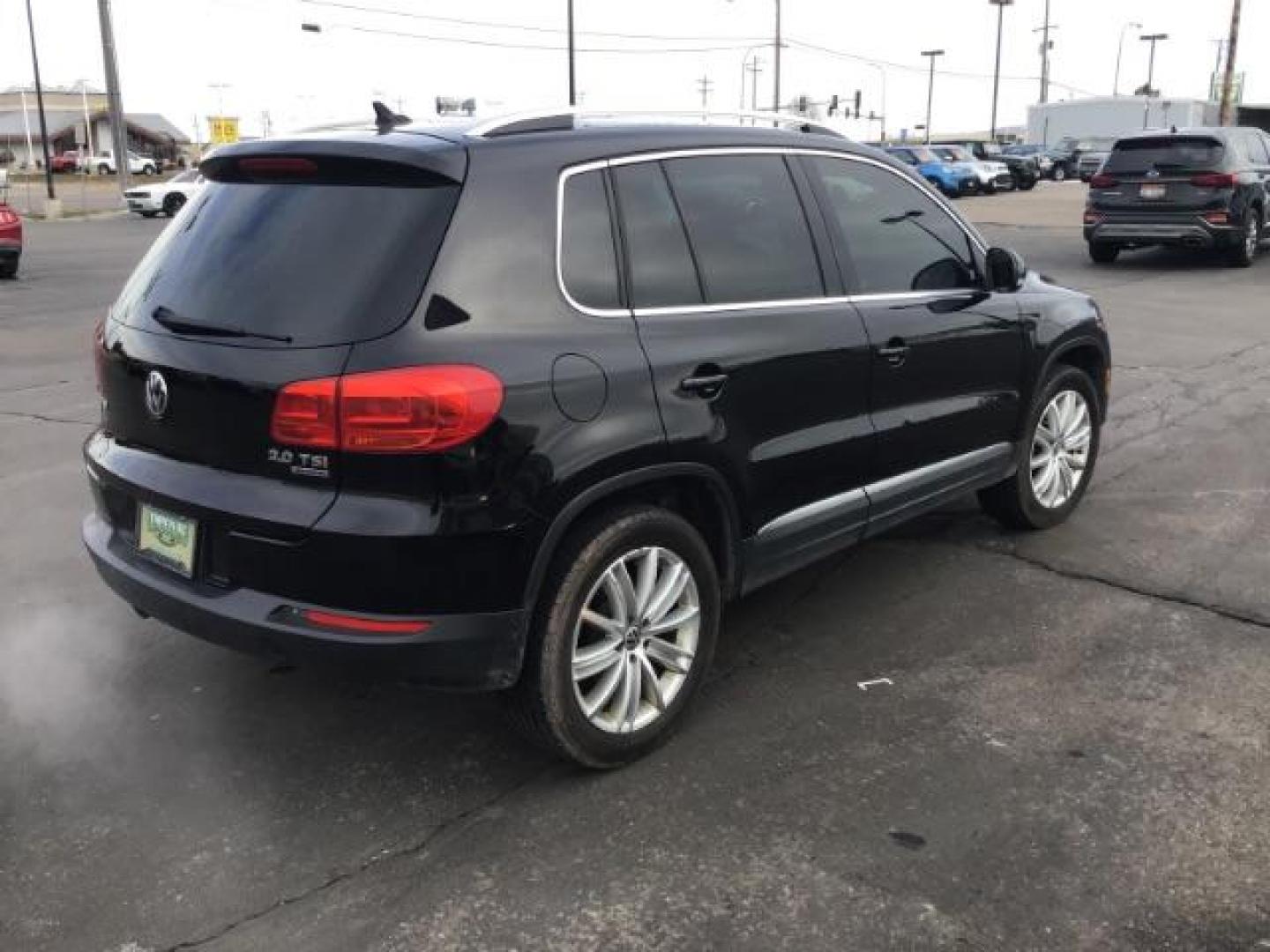 2013 Deep Black Metallic /Black Volkswagen Tiguan 2.0T S 4Motion (WVGBV7AX5DW) with an 2.0L L4 DOHC 16V TURBO engine, 6-Speed Automatic transmission, located at 1235 N Woodruff Ave., Idaho Falls, 83401, (208) 523-1053, 43.507172, -112.000488 - This 2013 Volkswagen Tiguan, has the 2.0T motor. It only has 95,000 miles. It comes with leather interior, heated seats, blue tooth audio, touch screen stereo, and cruise control. At Timberline Auto it is always easy to find a great deal on your next vehicle! Our experienced sales staff can help fin - Photo#3