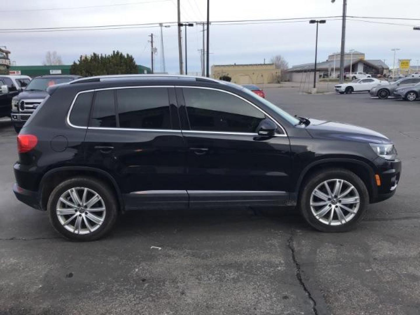 2013 Deep Black Metallic /Black Volkswagen Tiguan 2.0T S 4Motion (WVGBV7AX5DW) with an 2.0L L4 DOHC 16V TURBO engine, 6-Speed Automatic transmission, located at 1235 N Woodruff Ave., Idaho Falls, 83401, (208) 523-1053, 43.507172, -112.000488 - This 2013 Volkswagen Tiguan, has the 2.0T motor. It only has 95,000 miles. It comes with leather interior, heated seats, blue tooth audio, touch screen stereo, and cruise control. At Timberline Auto it is always easy to find a great deal on your next vehicle! Our experienced sales staff can help fin - Photo#4