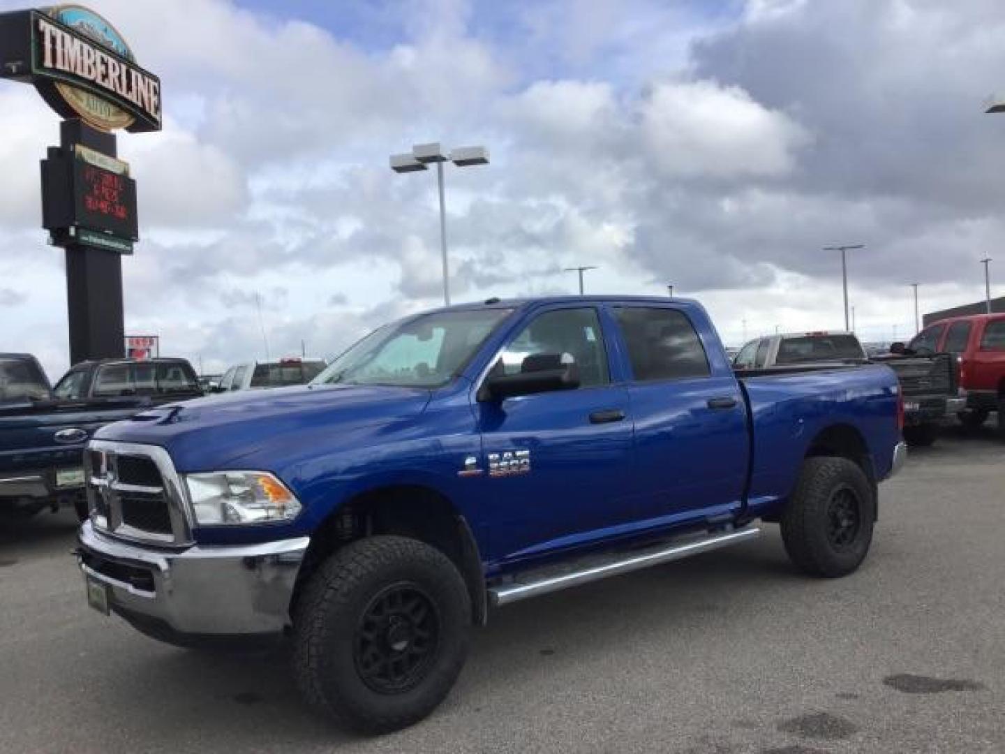 2014 BLUE /Diesel Gray/Black RAM 3500 ST Crew Cab SWB 4WD (3C63R3CL3EG) with an 6.7L L6 OHV 24V TURBO DIESEL engine, 6-Speed Automatic transmission, located at 1235 N Woodruff Ave., Idaho Falls, 83401, (208) 523-1053, 43.507172, -112.000488 - This 2014 Ram 3500 Tradesman 4x4, has the 6.7L diesel motor. It only has 73,000 miles. Comes with Cloth interior, keyless remote, cruise control, power windows and locks, and fixed running boards. At Timberline Auto it is always easy to find a great deal on your next vehicle! Our experienced sales s - Photo#0