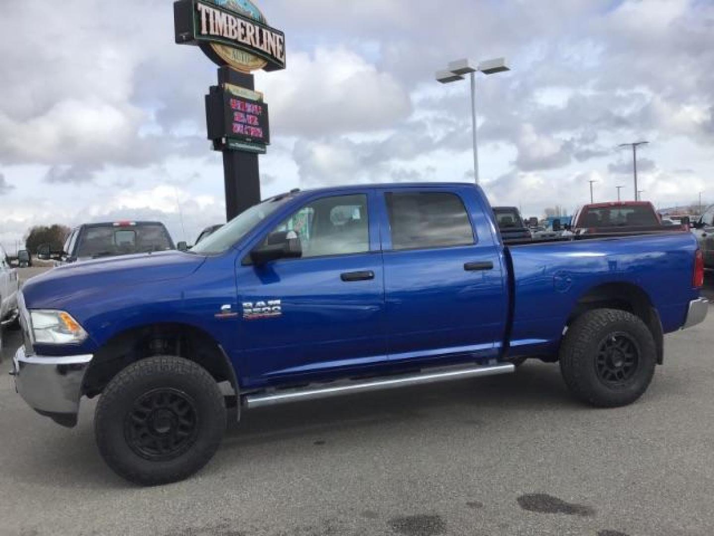 2014 BLUE /Diesel Gray/Black RAM 3500 ST Crew Cab SWB 4WD (3C63R3CL3EG) with an 6.7L L6 OHV 24V TURBO DIESEL engine, 6-Speed Automatic transmission, located at 1235 N Woodruff Ave., Idaho Falls, 83401, (208) 523-1053, 43.507172, -112.000488 - This 2014 Ram 3500 Tradesman 4x4, has the 6.7L diesel motor. It only has 73,000 miles. Comes with Cloth interior, keyless remote, cruise control, power windows and locks, and fixed running boards. At Timberline Auto it is always easy to find a great deal on your next vehicle! Our experienced sales s - Photo#1