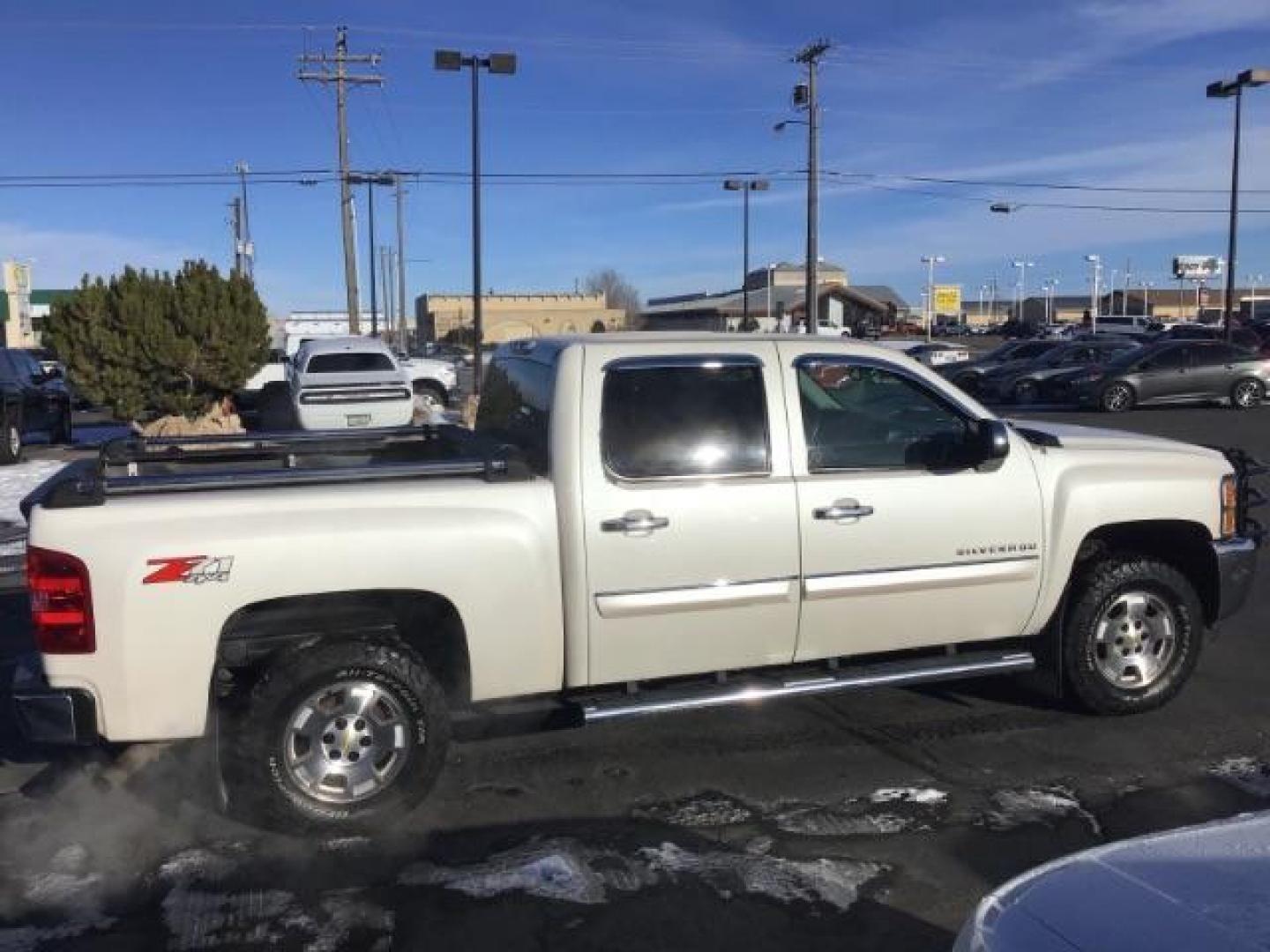 2012 White Diamond /Ebony Cloth Interior Chevrolet Silverado 1500 LT Crew Cab 4WD (3GCPKSE70CG) with an 5.3L V8 OHV 16V FFV engine, 6-Speed Automatic transmission, located at 1235 N Woodruff Ave., Idaho Falls, 83401, (208) 523-1053, 43.507172, -112.000488 - This 2012 Chevrolet 1500 LT, has the 5.3L V8 motor. It has 216,000 miles. It is 4x4, Comes with Power seats, cruise control, AM / FM CD stereo. At Timberline Auto it is always easy to find a great deal on your next vehicle! Our experienced sales staff can help find the right vehicle will fit your ne - Photo#5