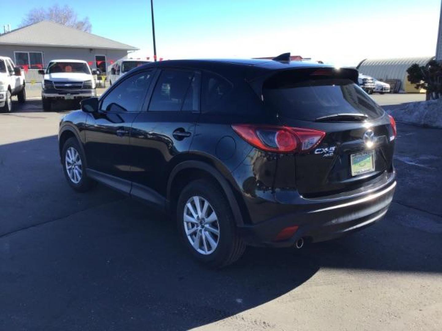 2016 DARK BLUE /Black, premium cloth Mazda CX-5 Touring AWD (JM3KE4CY8G0) with an 2.5L L4 DOHC 16V engine, 6-Speed Automatic transmission, located at 1235 N Woodruff Ave., Idaho Falls, 83401, (208) 523-1053, 43.507172, -112.000488 - This 2016 Mazda CX-5 AWD Touring, has 91,000 miles. Comes with cloth interior, back up camera, blue tooth audio, steering wheel controls, power seats, and power locks and windows. At Timberline Auto it is always easy to find a great deal on your next vehicle! Our experienced sales staff can help fin - Photo#2