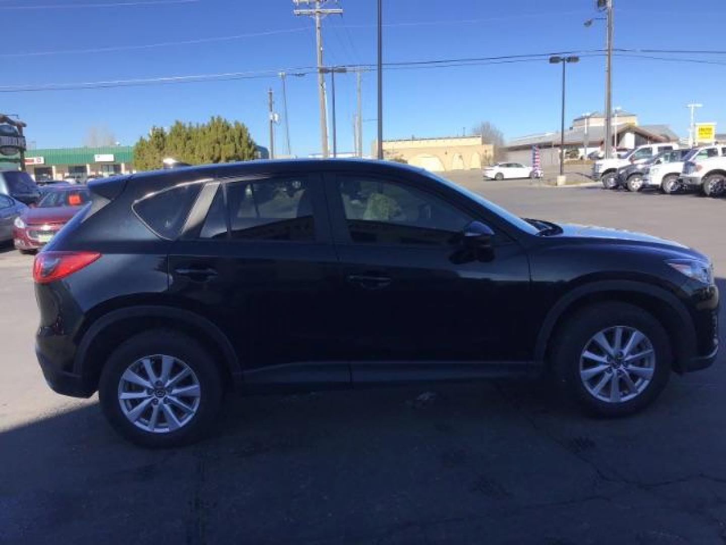 2016 DARK BLUE /Black, premium cloth Mazda CX-5 Touring AWD (JM3KE4CY8G0) with an 2.5L L4 DOHC 16V engine, 6-Speed Automatic transmission, located at 1235 N Woodruff Ave., Idaho Falls, 83401, (208) 523-1053, 43.507172, -112.000488 - This 2016 Mazda CX-5 AWD Touring, has 91,000 miles. Comes with cloth interior, back up camera, blue tooth audio, steering wheel controls, power seats, and power locks and windows. At Timberline Auto it is always easy to find a great deal on your next vehicle! Our experienced sales staff can help fin - Photo#5