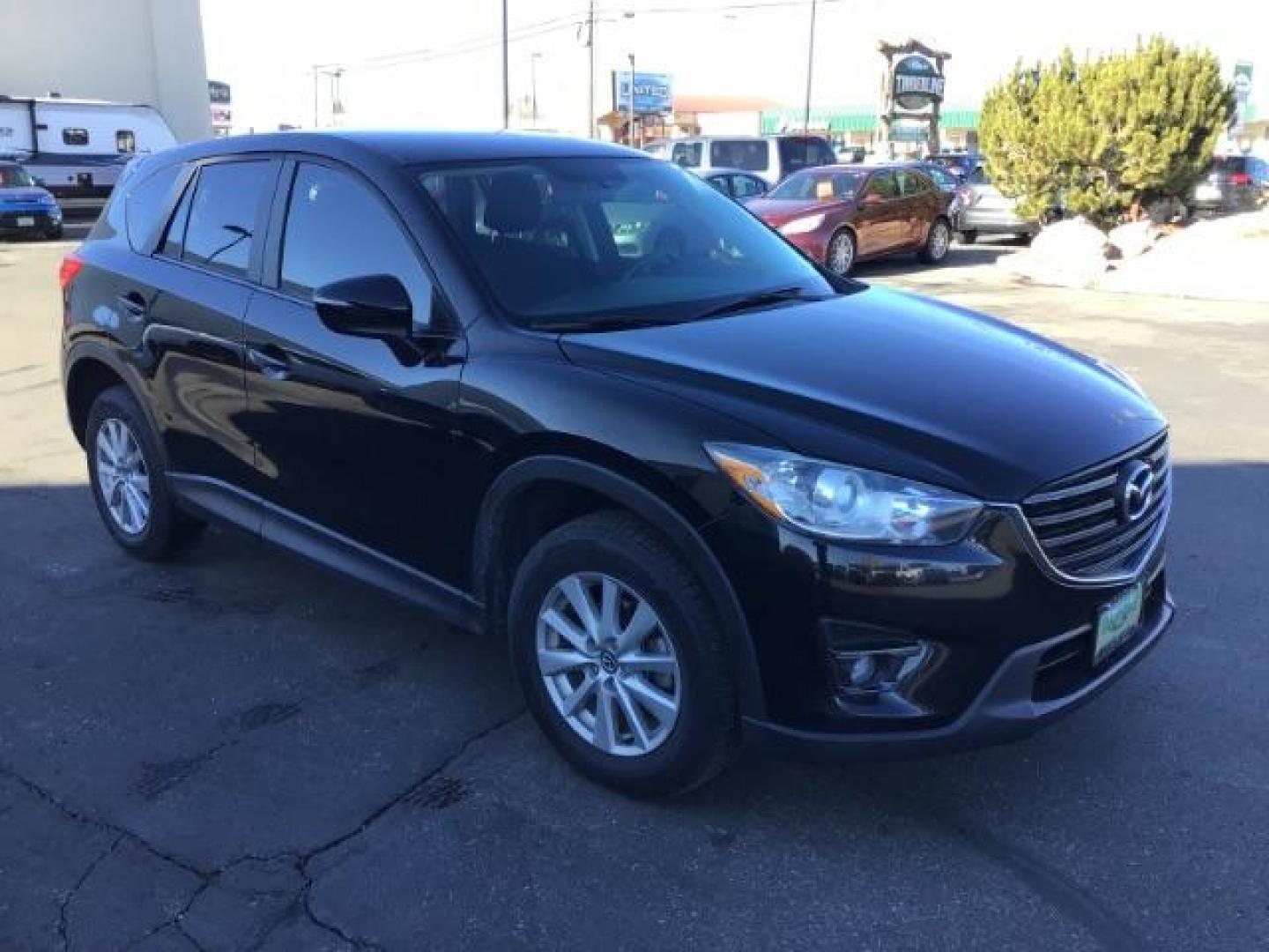 2016 DARK BLUE /Black, premium cloth Mazda CX-5 Touring AWD (JM3KE4CY8G0) with an 2.5L L4 DOHC 16V engine, 6-Speed Automatic transmission, located at 1235 N Woodruff Ave., Idaho Falls, 83401, (208) 523-1053, 43.507172, -112.000488 - This 2016 Mazda CX-5 AWD Touring, has 91,000 miles. Comes with cloth interior, back up camera, blue tooth audio, steering wheel controls, power seats, and power locks and windows. At Timberline Auto it is always easy to find a great deal on your next vehicle! Our experienced sales staff can help fin - Photo#6