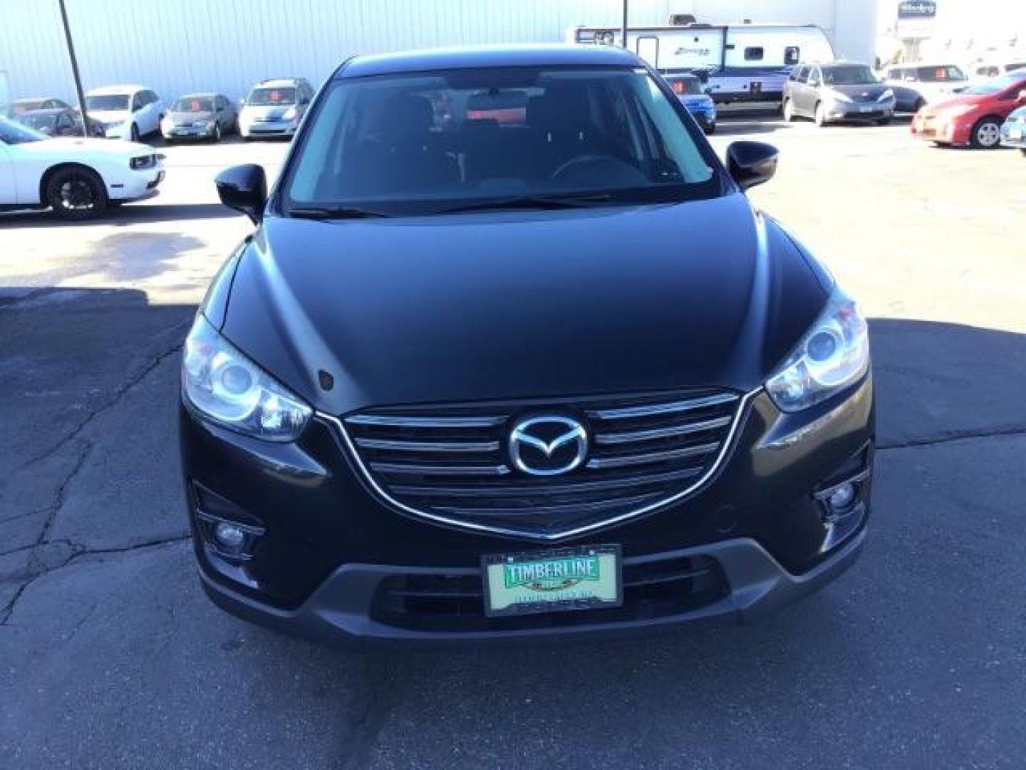 2016 DARK BLUE /Black, premium cloth Mazda CX-5 Touring AWD (JM3KE4CY8G0) with an 2.5L L4 DOHC 16V engine, 6-Speed Automatic transmission, located at 1235 N Woodruff Ave., Idaho Falls, 83401, (208) 523-1053, 43.507172, -112.000488 - This 2016 Mazda CX-5 AWD Touring, has 91,000 miles. Comes with cloth interior, back up camera, blue tooth audio, steering wheel controls, power seats, and power locks and windows. At Timberline Auto it is always easy to find a great deal on your next vehicle! Our experienced sales staff can help fin - Photo#7