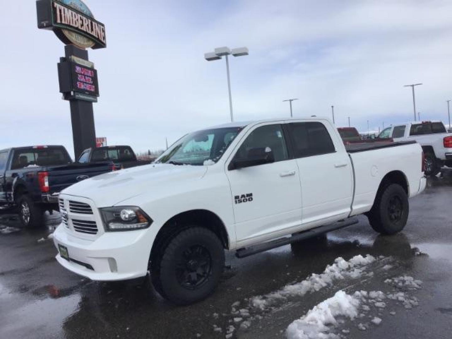 2014 Bright White Clearcoat /Black RAM 1500 Sport Crew Cab LWB 4WD (1C6RR7UT5ES) with an 5.7L V8 OHV 16V engine, 8-Speed Automatic transmission, located at 1235 N Woodruff Ave., Idaho Falls, 83401, (208) 523-1053, 43.507172, -112.000488 - This 2014 Ram 1500 Sport 4x4, has the 5.7L Hemi motor. It has 115,000 miles. Comes with leather interior, heated and cooled seats, power seats, blue tooth audio, back up camera, and power windows and locks. At Timberline Auto it is always easy to find a great deal on your next vehicle! Our experienc - Photo#0