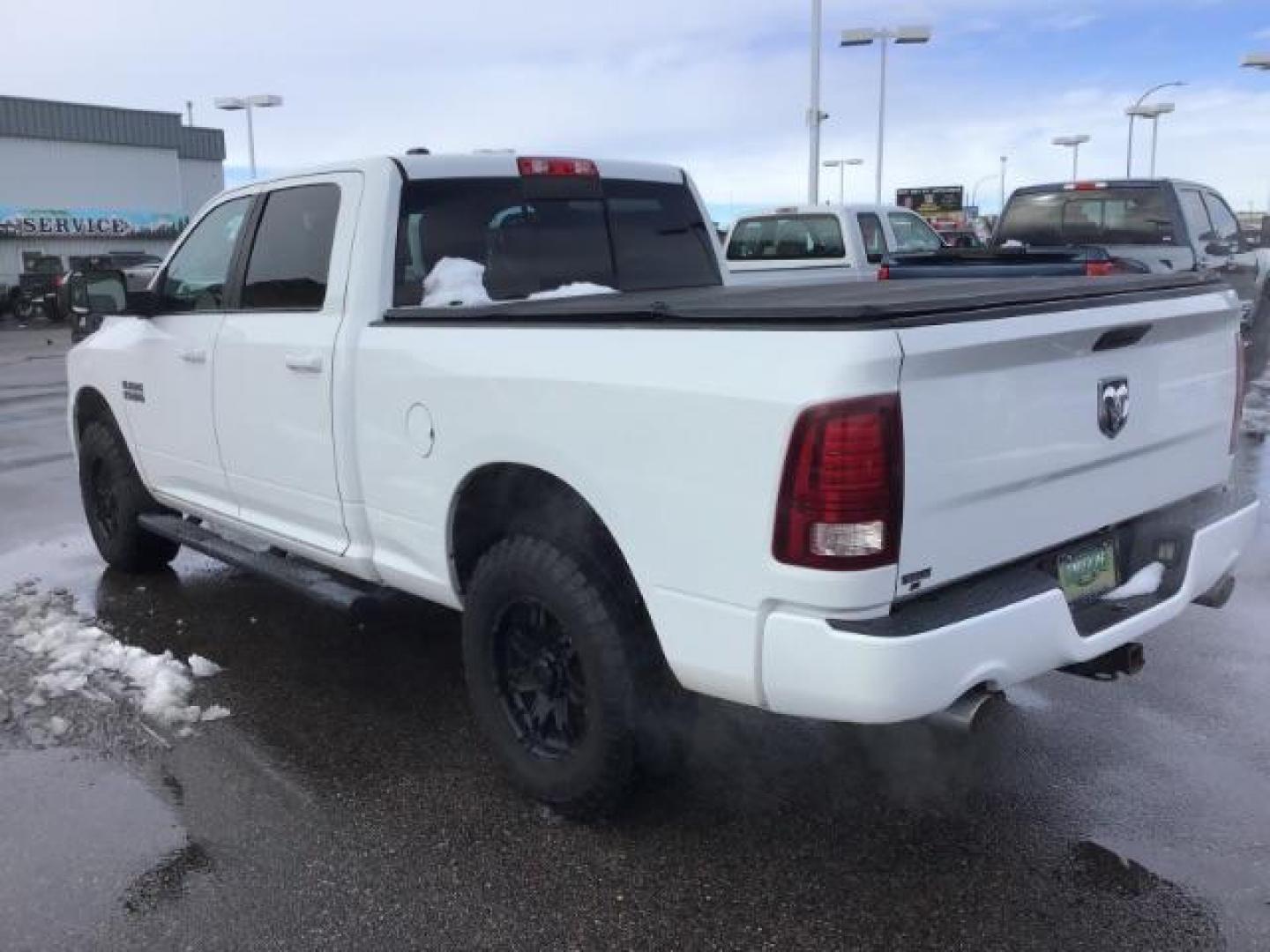 2014 Bright White Clearcoat /Black RAM 1500 Sport Crew Cab LWB 4WD (1C6RR7UT5ES) with an 5.7L V8 OHV 16V engine, 8-Speed Automatic transmission, located at 1235 N Woodruff Ave., Idaho Falls, 83401, (208) 523-1053, 43.507172, -112.000488 - This 2014 Ram 1500 Sport 4x4, has the 5.7L Hemi motor. It has 115,000 miles. Comes with leather interior, heated and cooled seats, power seats, blue tooth audio, back up camera, and power windows and locks. At Timberline Auto it is always easy to find a great deal on your next vehicle! Our experienc - Photo#2