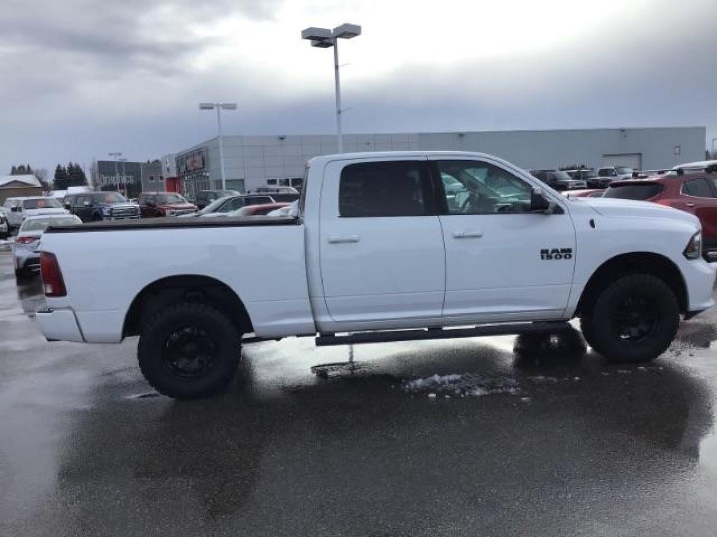 2014 Bright White Clearcoat /Black RAM 1500 Sport Crew Cab LWB 4WD (1C6RR7UT5ES) with an 5.7L V8 OHV 16V engine, 8-Speed Automatic transmission, located at 1235 N Woodruff Ave., Idaho Falls, 83401, (208) 523-1053, 43.507172, -112.000488 - This 2014 Ram 1500 Sport 4x4, has the 5.7L Hemi motor. It has 115,000 miles. Comes with leather interior, heated and cooled seats, power seats, blue tooth audio, back up camera, and power windows and locks. At Timberline Auto it is always easy to find a great deal on your next vehicle! Our experienc - Photo#5