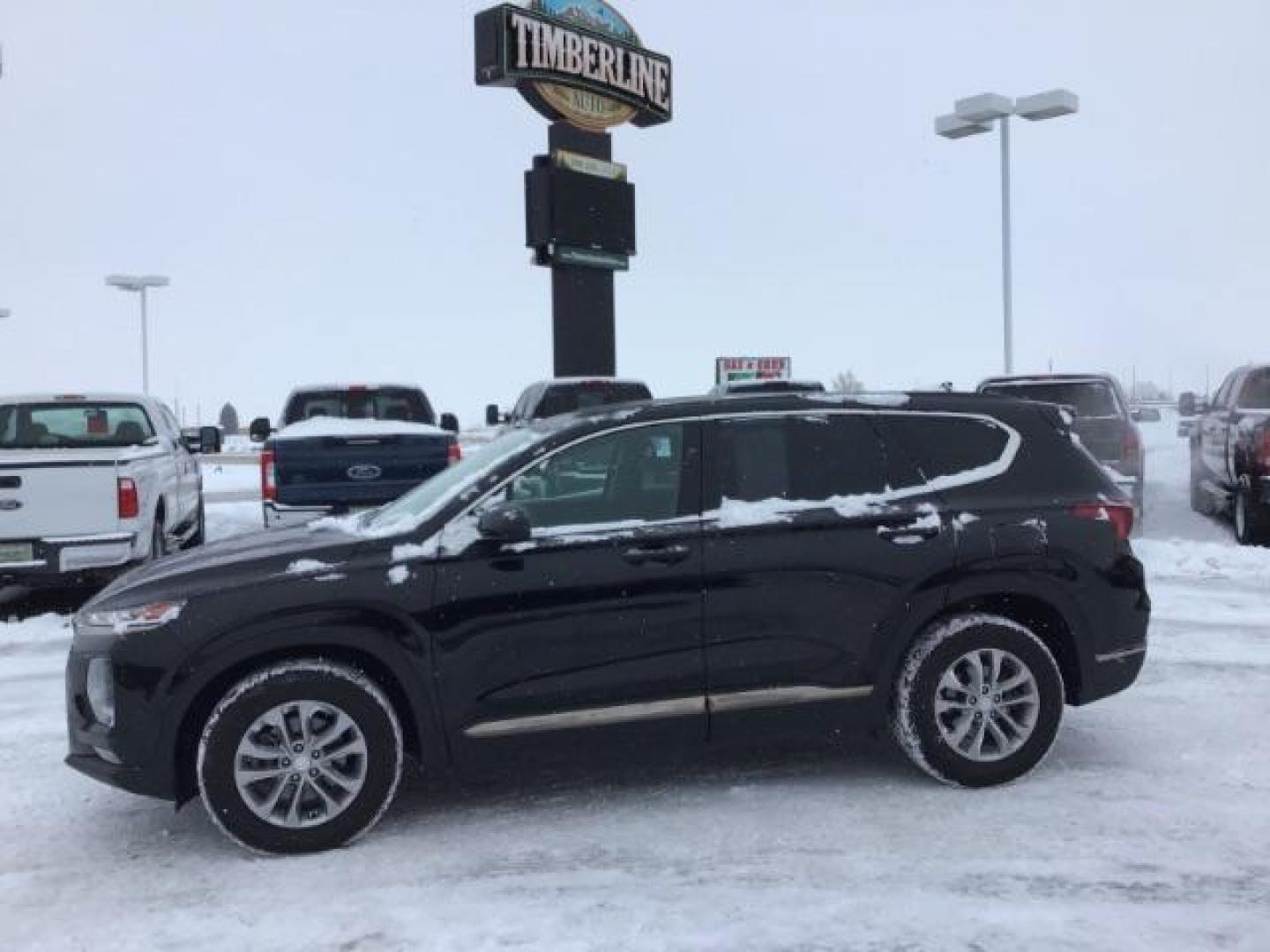 2019 Twilight Black /Black/Black, cloth Hyundai Santa Fe SEL 2.4 AWD (5NMS3CAD8KH) with an 2.4L L4 DOHC 16V engine, 8-Speed Automatic transmission, located at 1235 N Woodruff Ave., Idaho Falls, 83401, (208) 523-1053, 43.507172, -112.000488 - This 2019 Hyundai Santa Fe, has 65,000 miles. Comes with cloth seats, heated seats, blue tooth audio, and power windows and locks At Timberline Auto it is always easy to find a great deal on your next vehicle! Our experienced sales staff can help find the right vehicle that will fit your needs. Our - Photo#1