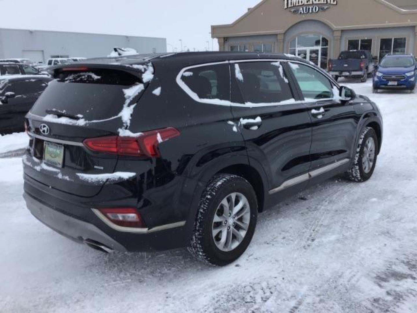 2019 Twilight Black /Black/Black, cloth Hyundai Santa Fe SEL 2.4 AWD (5NMS3CAD8KH) with an 2.4L L4 DOHC 16V engine, 8-Speed Automatic transmission, located at 1235 N Woodruff Ave., Idaho Falls, 83401, (208) 523-1053, 43.507172, -112.000488 - This 2019 Hyundai Santa Fe, has 65,000 miles. Comes with cloth seats, heated seats, blue tooth audio, and power windows and locks At Timberline Auto it is always easy to find a great deal on your next vehicle! Our experienced sales staff can help find the right vehicle that will fit your needs. Our - Photo#4