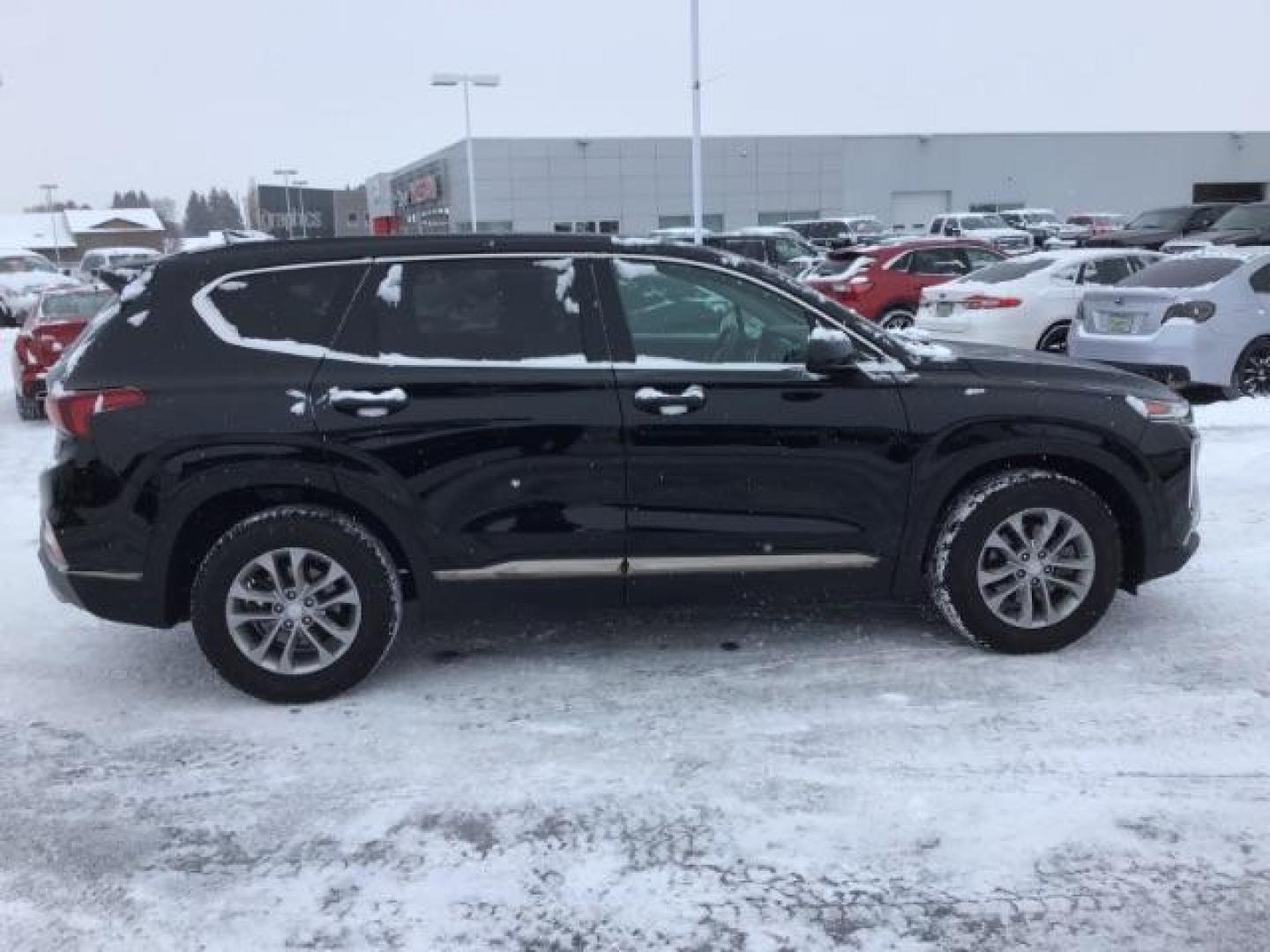 2019 Twilight Black /Black/Black, cloth Hyundai Santa Fe SEL 2.4 AWD (5NMS3CAD8KH) with an 2.4L L4 DOHC 16V engine, 8-Speed Automatic transmission, located at 1235 N Woodruff Ave., Idaho Falls, 83401, (208) 523-1053, 43.507172, -112.000488 - This 2019 Hyundai Santa Fe, has 65,000 miles. Comes with cloth seats, heated seats, blue tooth audio, and power windows and locks At Timberline Auto it is always easy to find a great deal on your next vehicle! Our experienced sales staff can help find the right vehicle that will fit your needs. Our - Photo#5