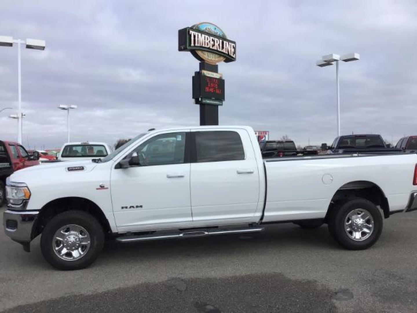 2021 Bright White Clear Coat /Black/Diesel Gray RAM 2500 Tradesman Crew Cab LWB 4WD (3C6UR5JL7MG) with an 6.7L L6 OHV 24V TURBO DIESEL engine, 6-Speed Automatic transmission, located at 1235 N Woodruff Ave., Idaho Falls, 83401, (208) 523-1053, 43.507172, -112.000488 - This 2021 Ram 2500 Bighorn 4x4, has the 6.7L diesel motor. It has 40,000 miles. It comes with cloth interior, integrated brake control, power windows and locks. At Timberline Auto it is always easy to find a great deal on your next vehicle! Our experienced sales staff can help find the right vehicle - Photo#1