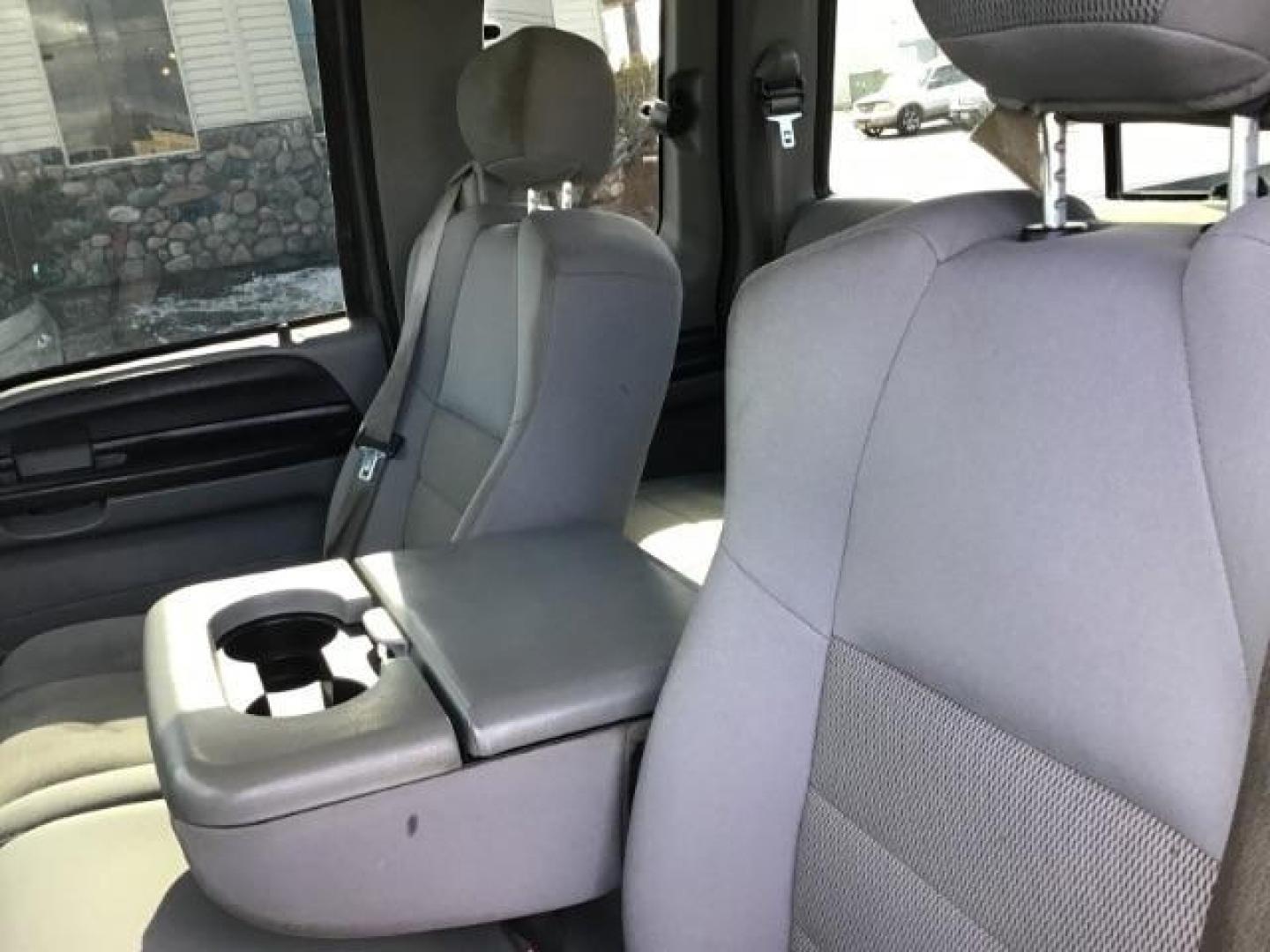 2006 Black /Medium Flint Cloth Interior Ford F-250 SD XLT SuperCab 4WD (1FTSX21PX6E) with an 6.0L V8 OHV 32V TURBO DIESEL engine, 5-Speed Automatic transmission, located at 1235 N Woodruff Ave., Idaho Falls, 83401, (208) 523-1053, 43.507172, -112.000488 - This 2006 Ford F250 4x4 XLT, has a 6.0L powerstroke motor. It has 140,000 miles. Comes with cloth seats, cruise control, AM/FM CD stereo, and power windows and locks. At Timberline Auto it is always easy to find a great deal on your next vehicle! Our experienced sales staff can help find the right v - Photo#9