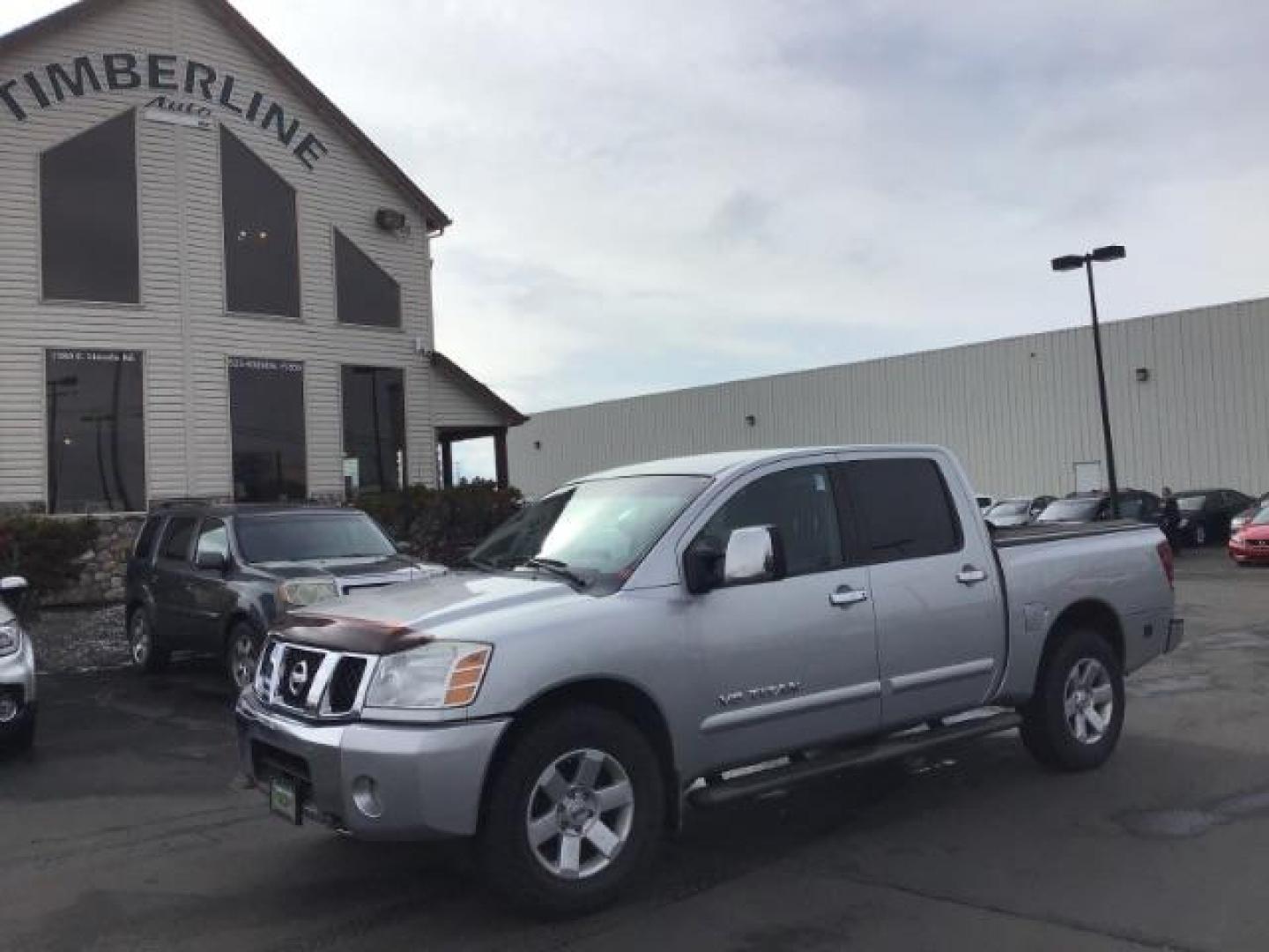 2006 Radiant Silver Nissan Titan LE Crew Cab 4WD (1N6AA07B06N) with an 5.6L V8 DOHC 32V engine, 5-Speed Automatic transmission, located at 1235 N Woodruff Ave., Idaho Falls, 83401, (208) 523-1053, 43.507172, -112.000488 - This 2006 Nissan Titan LE 4x4 , has 189,000 miles. Comes with leather interior, heated seats, AM/FM CD stereo, power seats, cruise control, power windows and locks. At Timberline Auto it is always easy to find a great deal on your next vehicle! Our experienced sales staff can help find the right ve - Photo#0