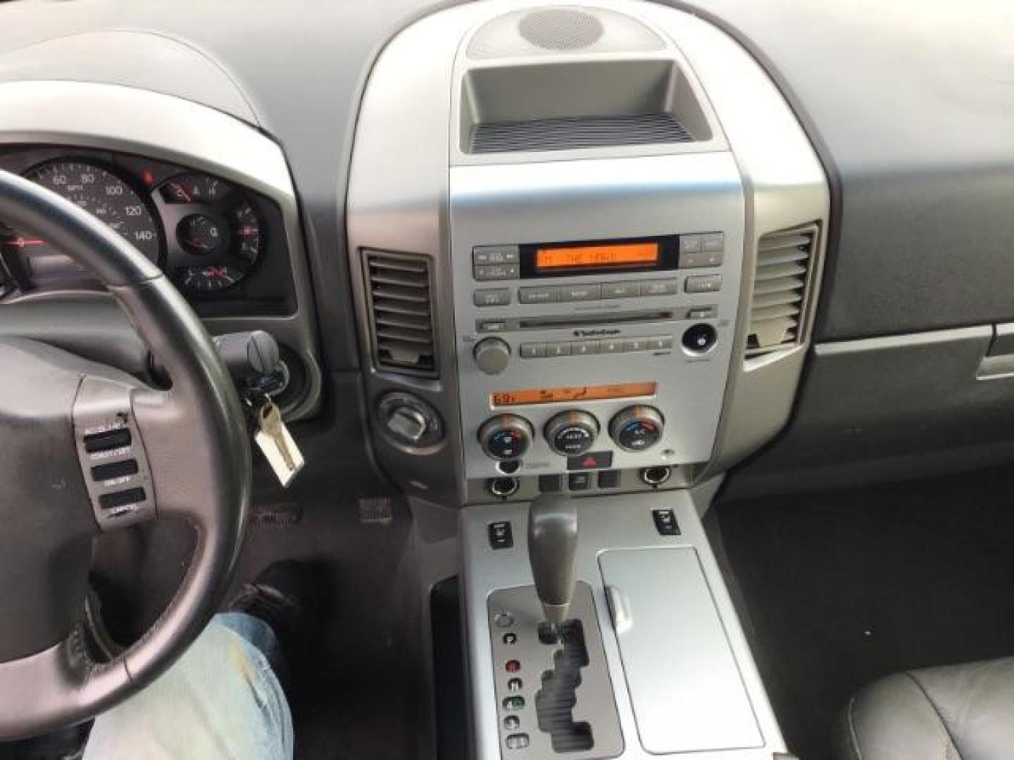 2006 Radiant Silver Nissan Titan LE Crew Cab 4WD (1N6AA07B06N) with an 5.6L V8 DOHC 32V engine, 5-Speed Automatic transmission, located at 1235 N Woodruff Ave., Idaho Falls, 83401, (208) 523-1053, 43.507172, -112.000488 - This 2006 Nissan Titan LE 4x4 , has 189,000 miles. Comes with leather interior, heated seats, AM/FM CD stereo, power seats, cruise control, power windows and locks. At Timberline Auto it is always easy to find a great deal on your next vehicle! Our experienced sales staff can help find the right ve - Photo#10