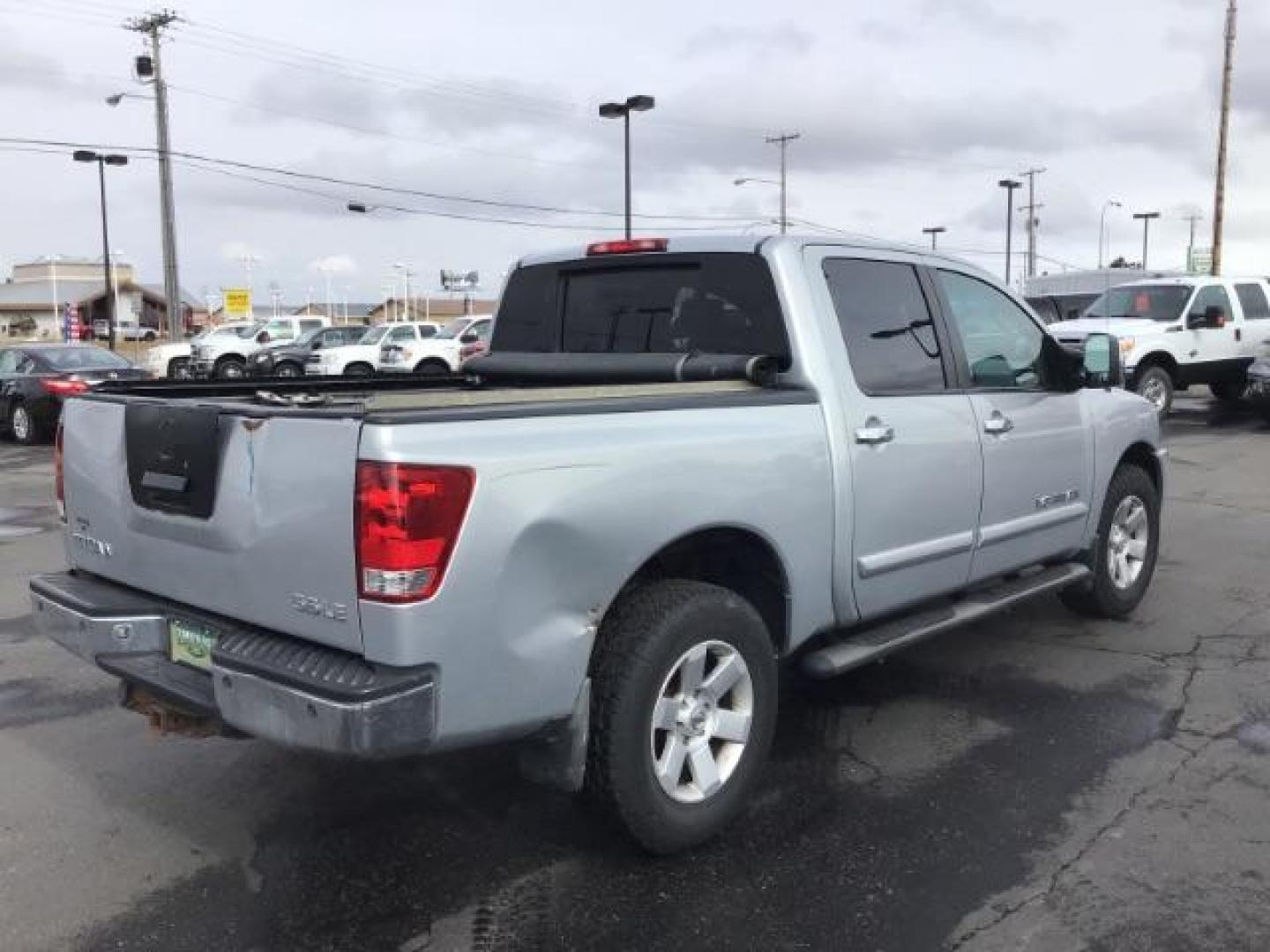 2006 Radiant Silver Nissan Titan LE Crew Cab 4WD (1N6AA07B06N) with an 5.6L V8 DOHC 32V engine, 5-Speed Automatic transmission, located at 1235 N Woodruff Ave., Idaho Falls, 83401, (208) 523-1053, 43.507172, -112.000488 - This 2006 Nissan Titan LE 4x4 , has 189,000 miles. Comes with leather interior, heated seats, AM/FM CD stereo, power seats, cruise control, power windows and locks. At Timberline Auto it is always easy to find a great deal on your next vehicle! Our experienced sales staff can help find the right ve - Photo#4