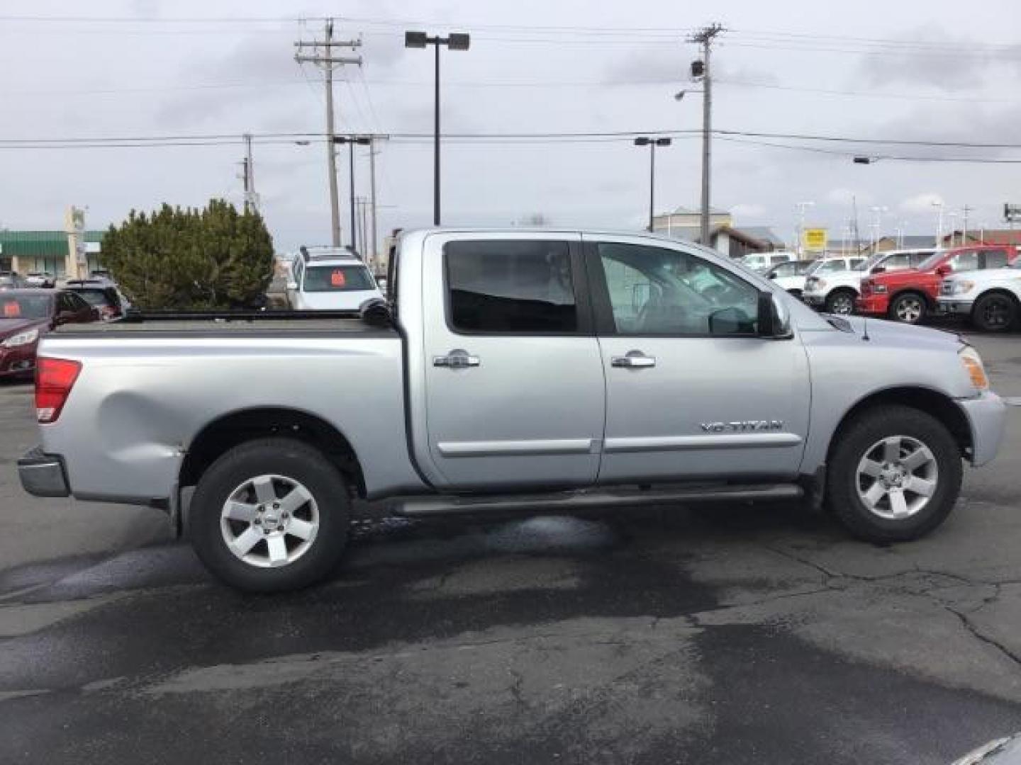 2006 Radiant Silver Nissan Titan LE Crew Cab 4WD (1N6AA07B06N) with an 5.6L V8 DOHC 32V engine, 5-Speed Automatic transmission, located at 1235 N Woodruff Ave., Idaho Falls, 83401, (208) 523-1053, 43.507172, -112.000488 - This 2006 Nissan Titan LE 4x4 , has 189,000 miles. Comes with leather interior, heated seats, AM/FM CD stereo, power seats, cruise control, power windows and locks. At Timberline Auto it is always easy to find a great deal on your next vehicle! Our experienced sales staff can help find the right ve - Photo#5