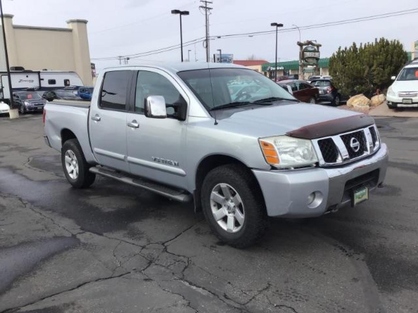 2006 Radiant Silver Nissan Titan LE Crew Cab 4WD (1N6AA07B06N) with an 5.6L V8 DOHC 32V engine, 5-Speed Automatic transmission, located at 1235 N Woodruff Ave., Idaho Falls, 83401, (208) 523-1053, 43.507172, -112.000488 - This 2006 Nissan Titan LE 4x4 , has 189,000 miles. Comes with leather interior, heated seats, AM/FM CD stereo, power seats, cruise control, power windows and locks. At Timberline Auto it is always easy to find a great deal on your next vehicle! Our experienced sales staff can help find the right ve - Photo#6