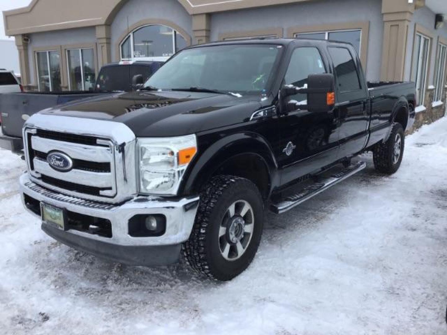 2011 Tuxedo Black Metallic/Pale Adobe Metallic /Black Leather Interior Ford F-350 SD Lariat Crew Cab Long Bed 4WD (1FT8W3BT0BE) with an 6.7L V8 OHV 16V DIESEL engine, 6-Speed Automatic transmission, located at 1235 N Woodruff Ave., Idaho Falls, 83401, (208) 523-1053, 43.507172, -112.000488 - Photo#0