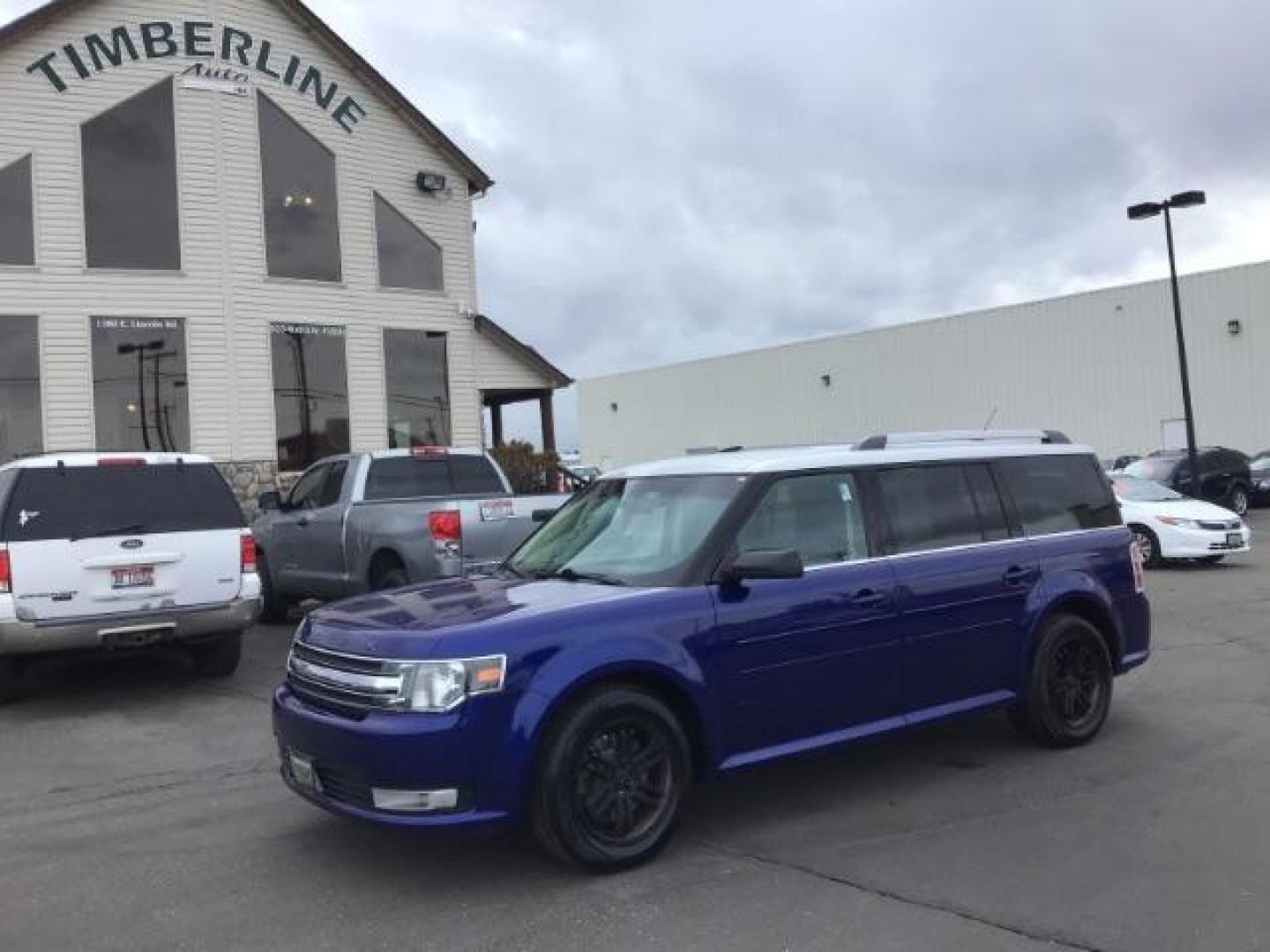 2013 Deep Impact Blue Metallic /Charcoal Black Leather Interior Ford Flex SEL FWD (2FMGK5C88DB) with an 3.5L V6 DOHC 24V engine, 6-Speed Automatic Overdrive transmission, located at 1235 N Woodruff Ave., Idaho Falls, 83401, (208) 523-1053, 43.507172, -112.000488 - This 2013 Ford Flex SEL FWD, has 164,000 miles. Comes with leather interior, heated seats, blue tooth audio, 3rd row seating, power seats, cruise control, and power windows and locks. At Timberline Auto it is always easy to find a great deal on your next vehicle! Our experienced sales staff can help - Photo#0