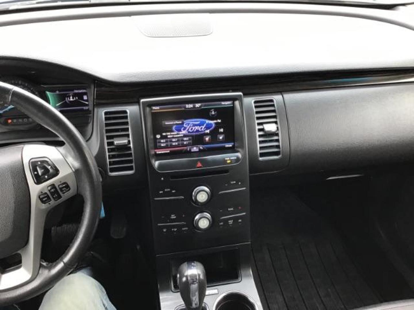 2013 Deep Impact Blue Metallic /Charcoal Black Leather Interior Ford Flex SEL FWD (2FMGK5C88DB) with an 3.5L V6 DOHC 24V engine, 6-Speed Automatic Overdrive transmission, located at 1235 N Woodruff Ave., Idaho Falls, 83401, (208) 523-1053, 43.507172, -112.000488 - This 2013 Ford Flex SEL FWD, has 164,000 miles. Comes with leather interior, heated seats, blue tooth audio, 3rd row seating, power seats, cruise control, and power windows and locks. At Timberline Auto it is always easy to find a great deal on your next vehicle! Our experienced sales staff can help - Photo#10