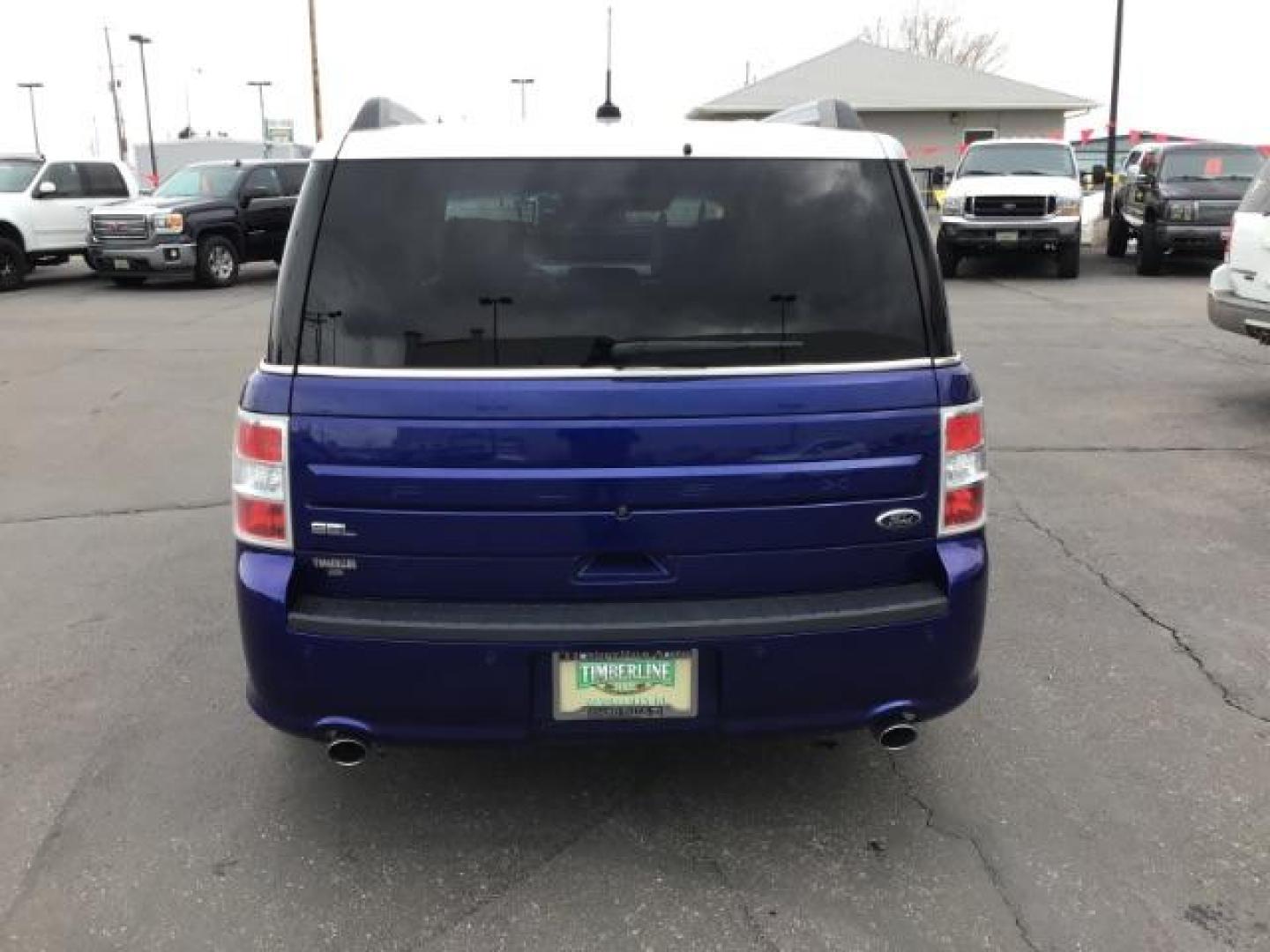 2013 Deep Impact Blue Metallic /Charcoal Black Leather Interior Ford Flex SEL FWD (2FMGK5C88DB) with an 3.5L V6 DOHC 24V engine, 6-Speed Automatic Overdrive transmission, located at 1235 N Woodruff Ave., Idaho Falls, 83401, (208) 523-1053, 43.507172, -112.000488 - This 2013 Ford Flex SEL FWD, has 164,000 miles. Comes with leather interior, heated seats, blue tooth audio, 3rd row seating, power seats, cruise control, and power windows and locks. At Timberline Auto it is always easy to find a great deal on your next vehicle! Our experienced sales staff can help - Photo#3