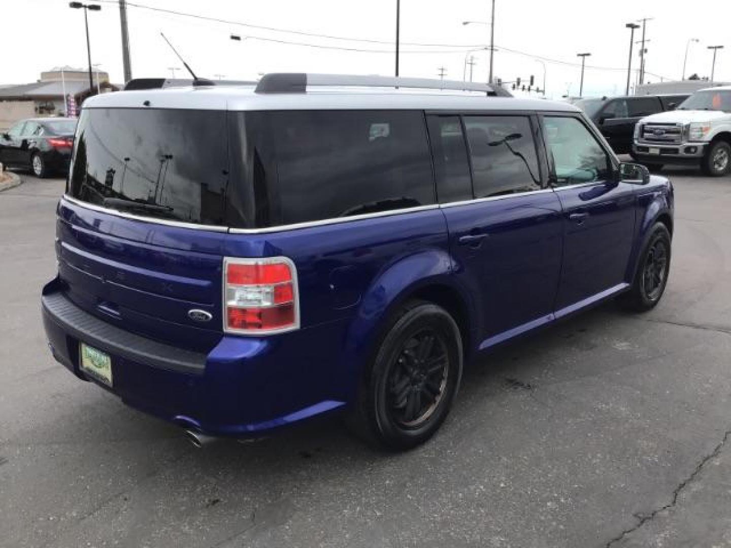 2013 Deep Impact Blue Metallic /Charcoal Black Leather Interior Ford Flex SEL FWD (2FMGK5C88DB) with an 3.5L V6 DOHC 24V engine, 6-Speed Automatic Overdrive transmission, located at 1235 N Woodruff Ave., Idaho Falls, 83401, (208) 523-1053, 43.507172, -112.000488 - This 2013 Ford Flex SEL FWD, has 164,000 miles. Comes with leather interior, heated seats, blue tooth audio, 3rd row seating, power seats, cruise control, and power windows and locks. At Timberline Auto it is always easy to find a great deal on your next vehicle! Our experienced sales staff can help - Photo#4