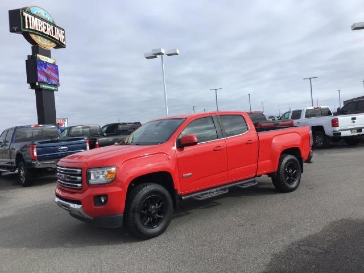 2015 Cardinal Red /Jet Black GMC Canyon SLE Crew Cab 4WD Short Box (1GTG6BE31F1) with an 3.6L V6 DOHC 24V engine, 6-Speed Automatic transmission, located at 1235 N Woodruff Ave., Idaho Falls, 83401, (208) 523-1053, 43.507172, -112.000488 - This 2015 GMC Canyon SLT 4x4, has 90,000 miles. Comes with leather interior, heated seats, Bose sound, back up camera, and spray in bed liner. At Timberline Auto it is always easy to find a great deal on your next vehicle! Our experienced sales staff can help find the right vehicle that will fit you - Photo#0